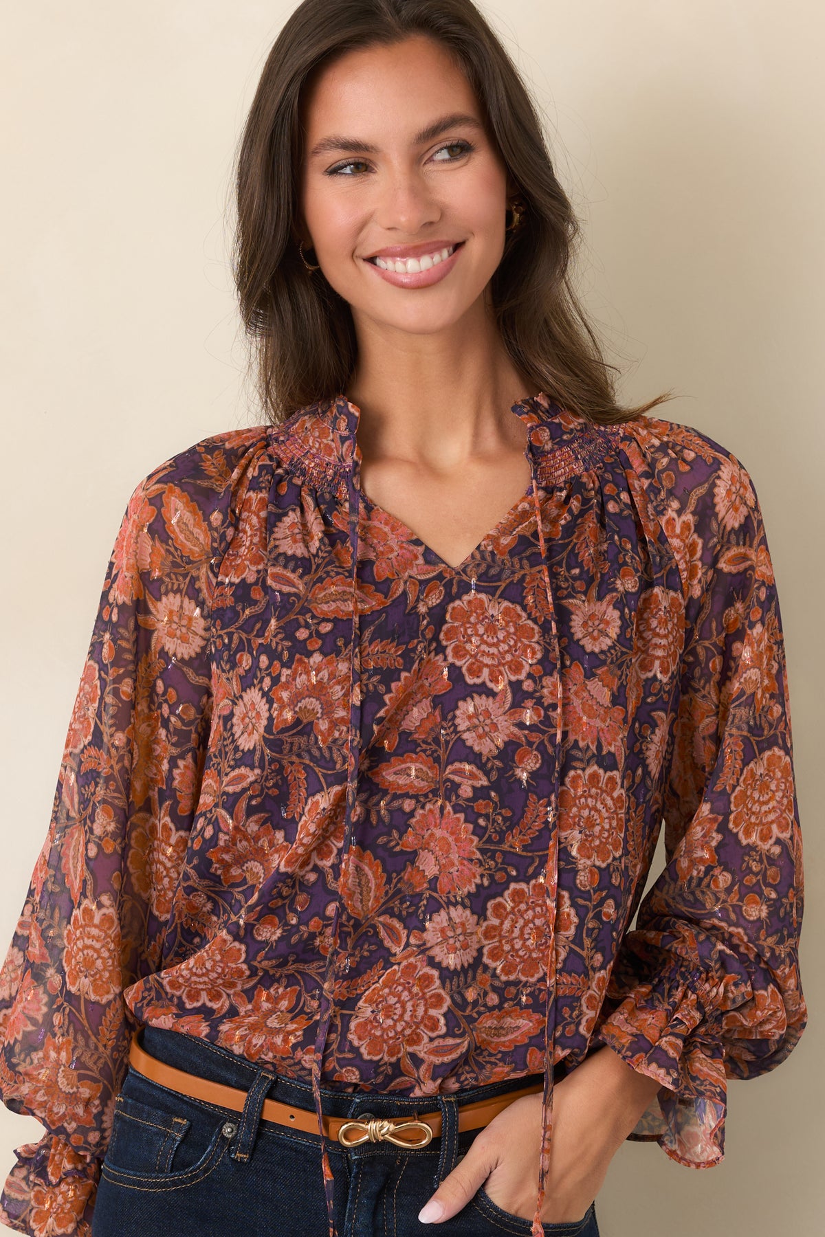 Floral top with a ruffled split neckline and delicate ties at the front.