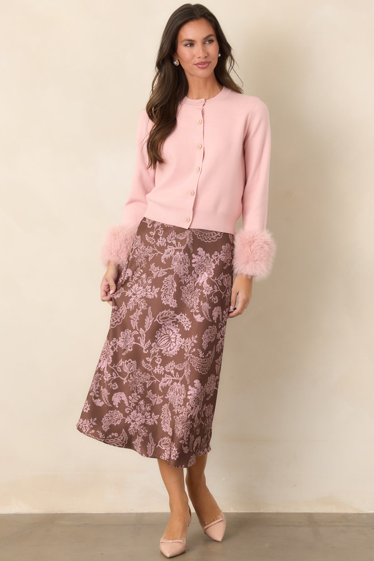 Floral satin midi skirt with a flowing silhouette that gently flares toward the hem.