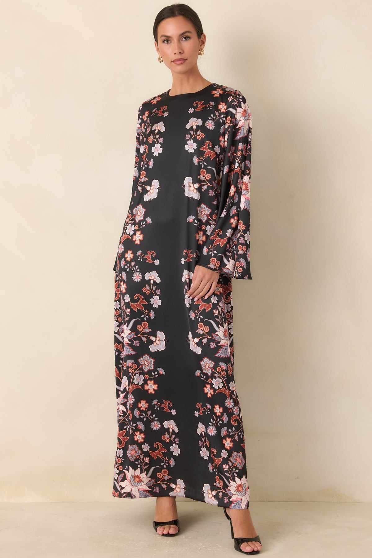 Floral satin maxi dress with a relaxed silhouette extending to a sweeping hem.