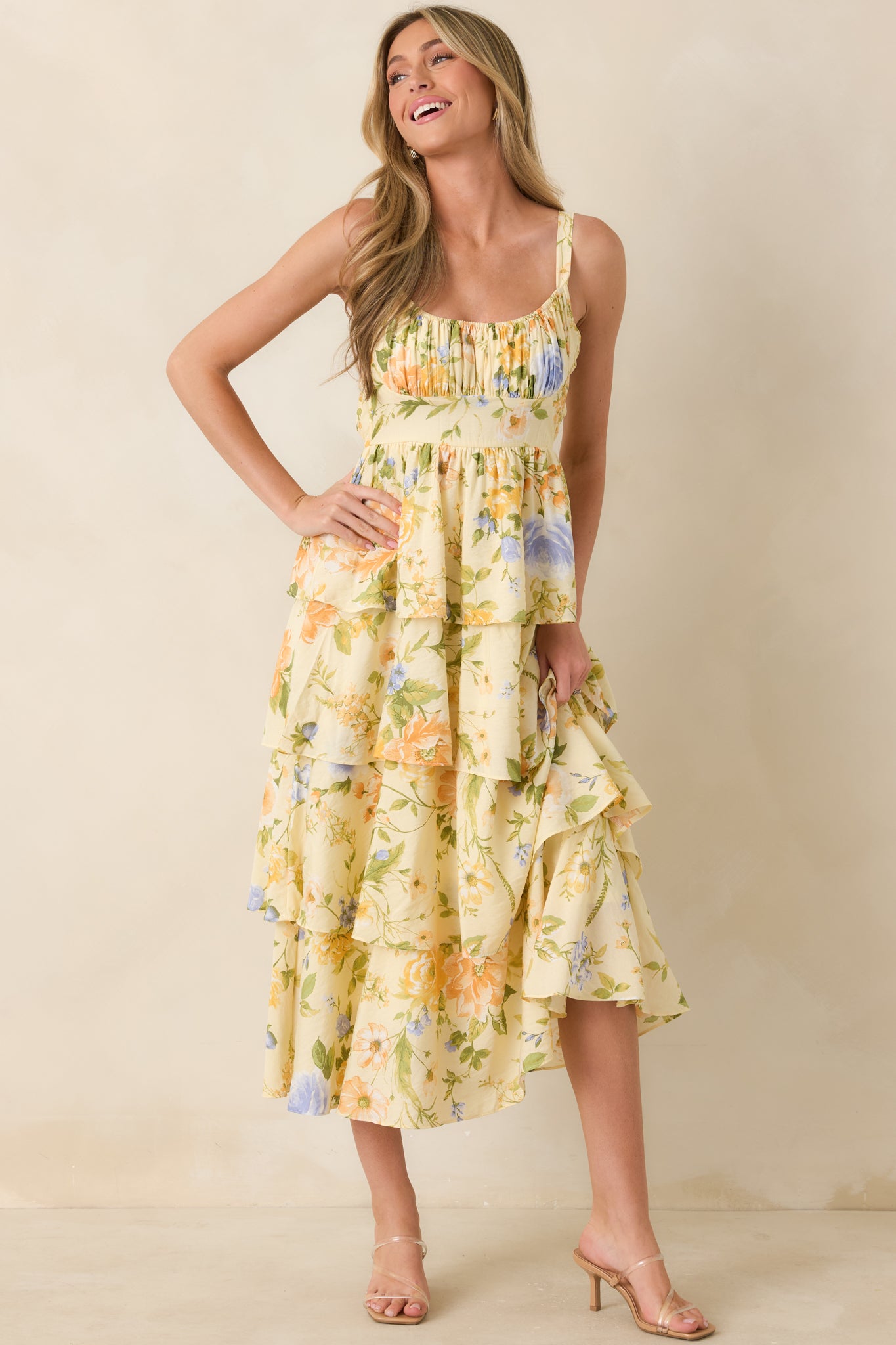 Floral maxi dress highlighting the adjustable tie straps, elasticized smocked panel, and graceful full-length silhouette.