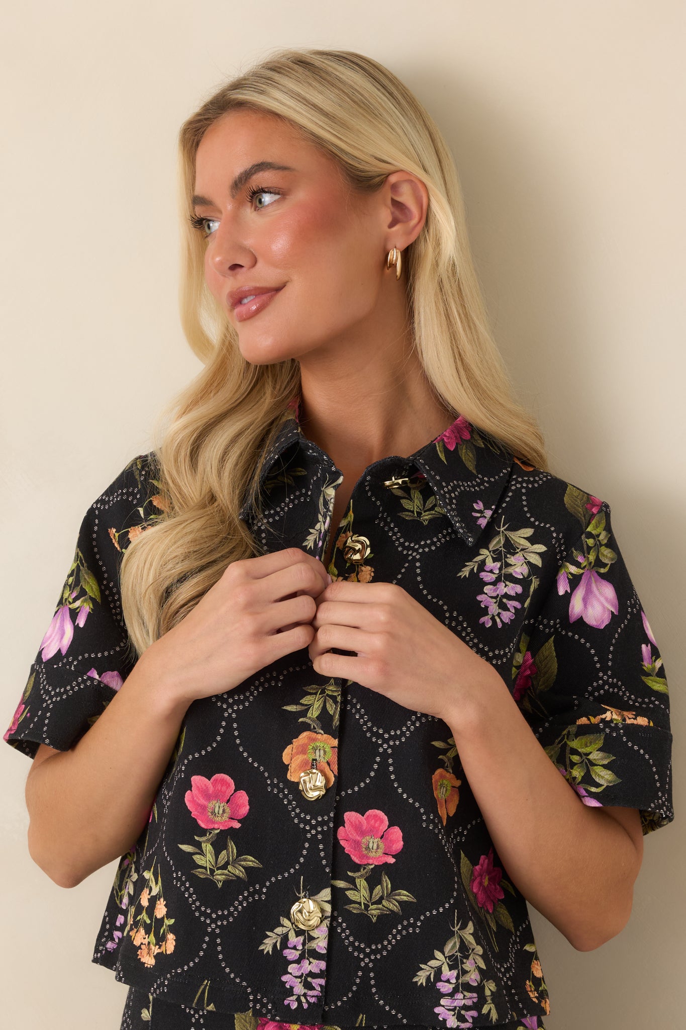 Colorful blooms arranged within a dotted lattice pattern define this cotton-blend cropped top.
