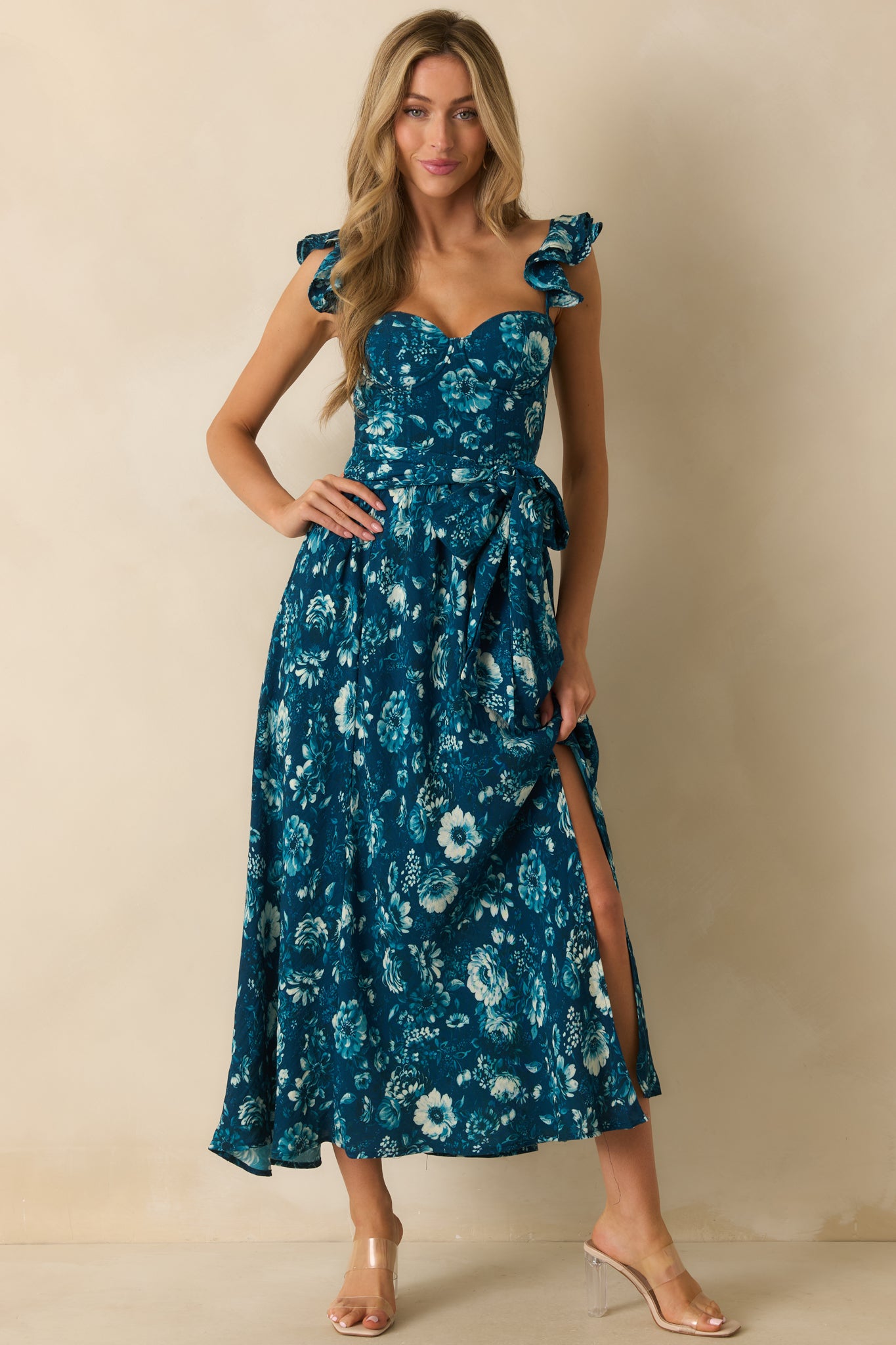 Flowing dark teal floral dress with boned corset front, underwire bust, and adjustable tie belt at the waist.
