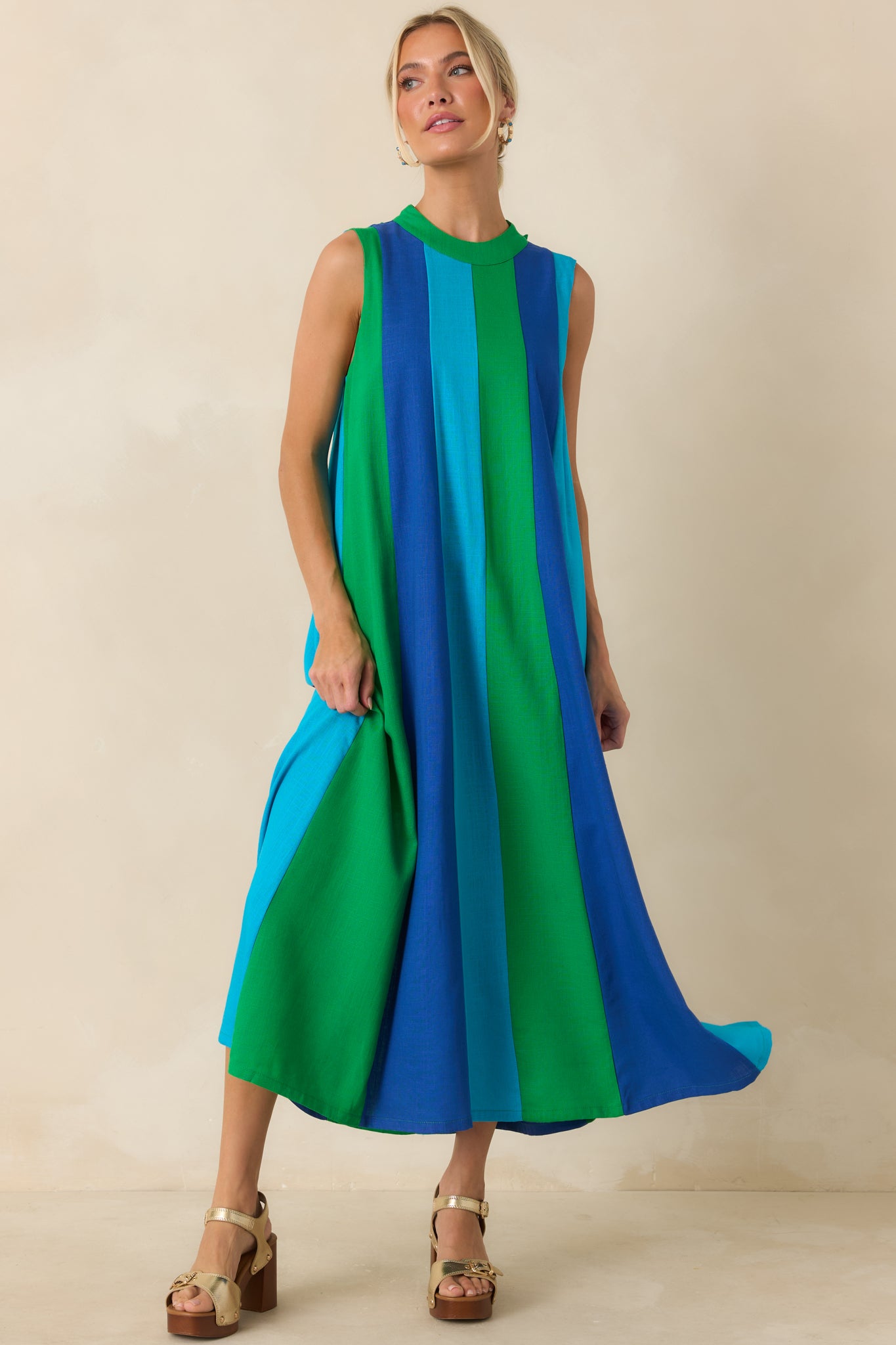 Flowing midi dress featuring cobalt blue, turquoise, and green panels arranged in a bold vertical design.