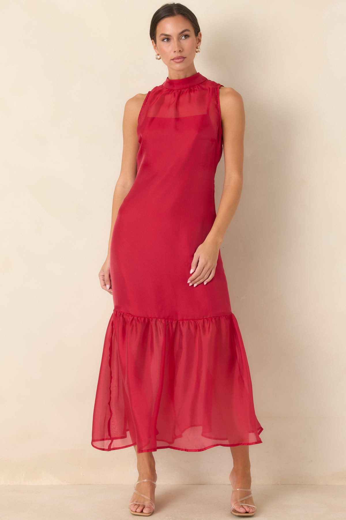 Flowing organza maxi dress showcasing the airy overlay and softly gathered skirt hem.