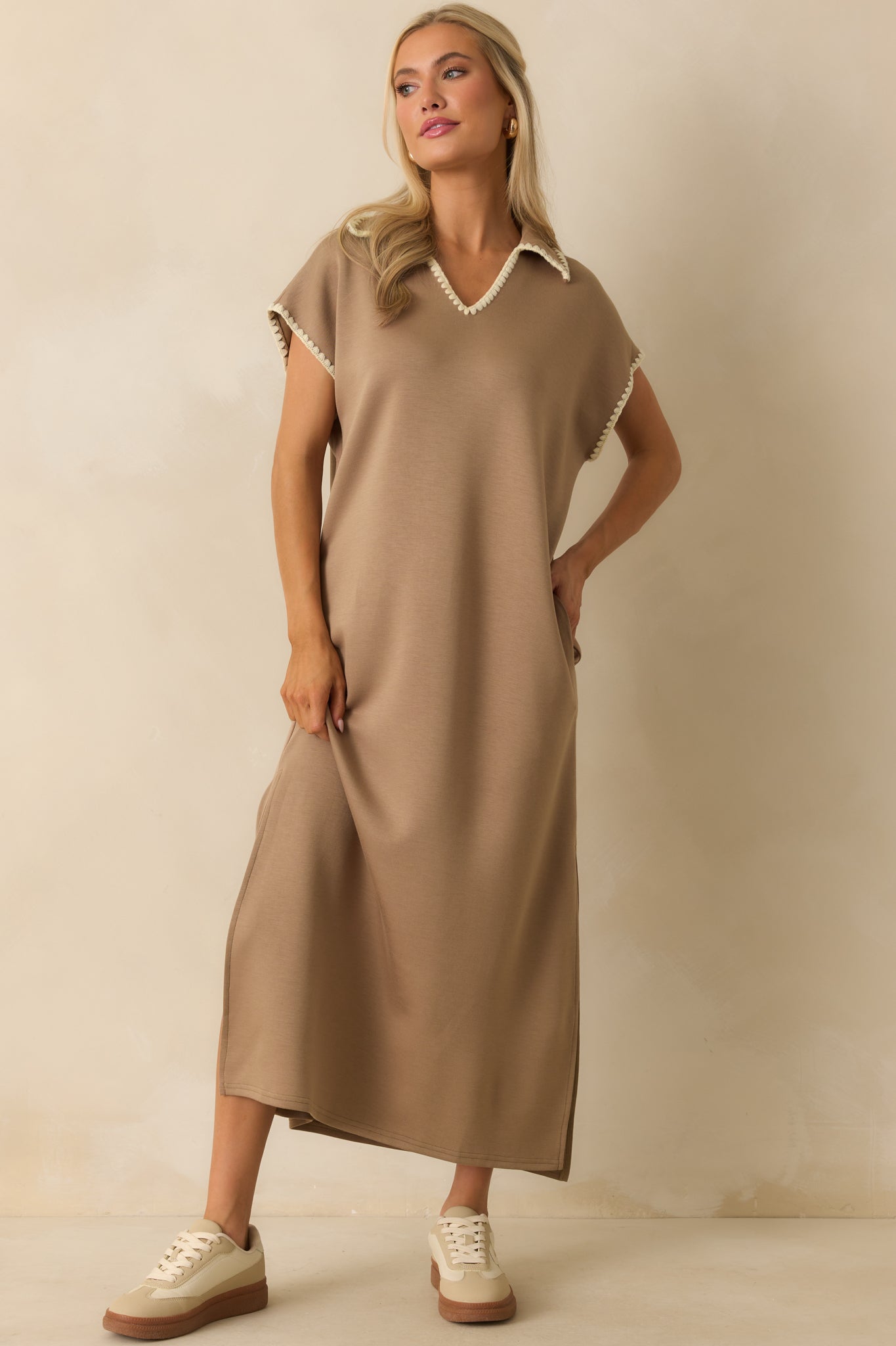 Flowing tan maxi dress with a notch v-neckline and comfortable short sleeves.