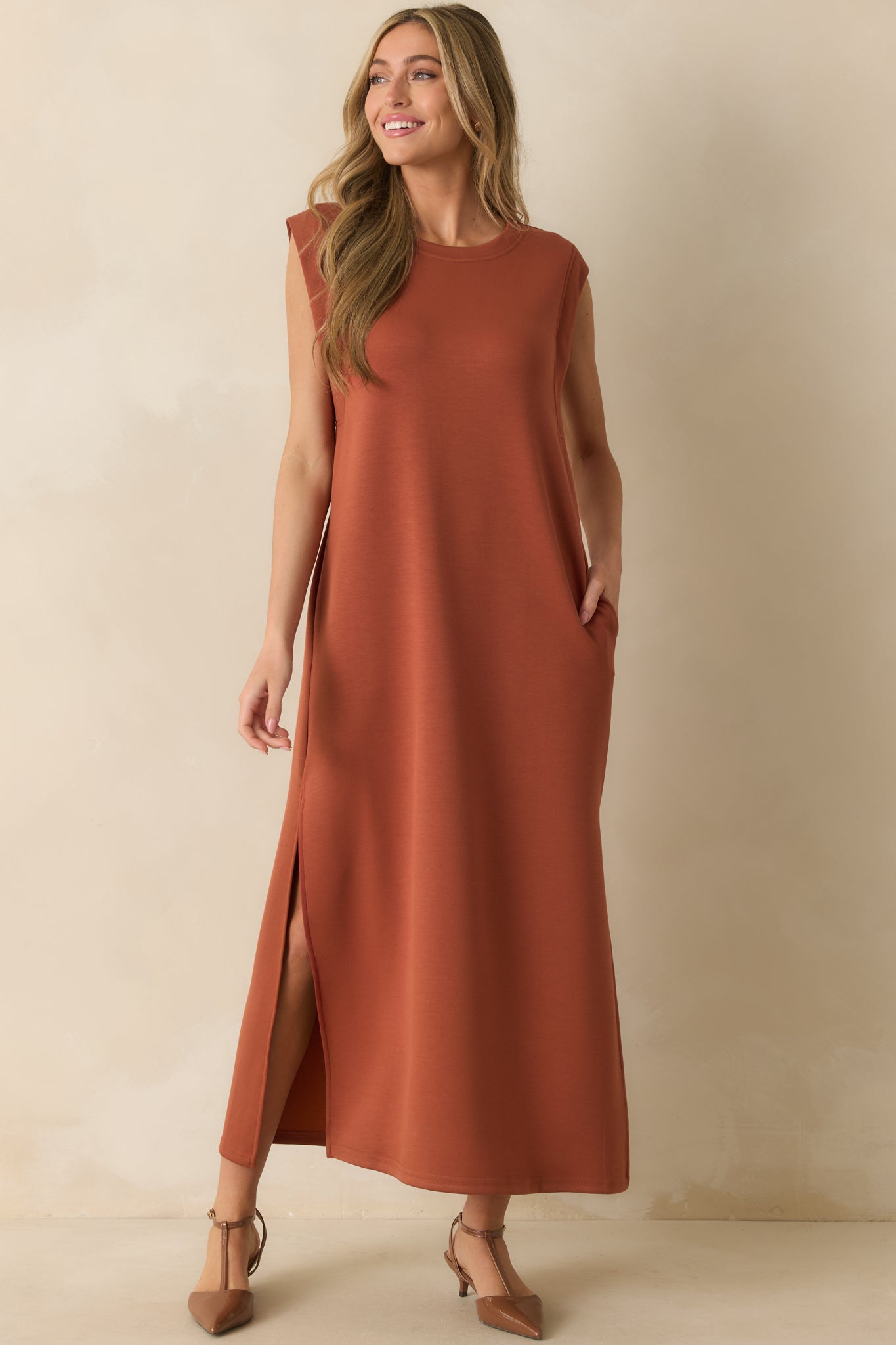 Flowing terracotta dress with relaxed fit, crew neckline, and easy slip-on shape.