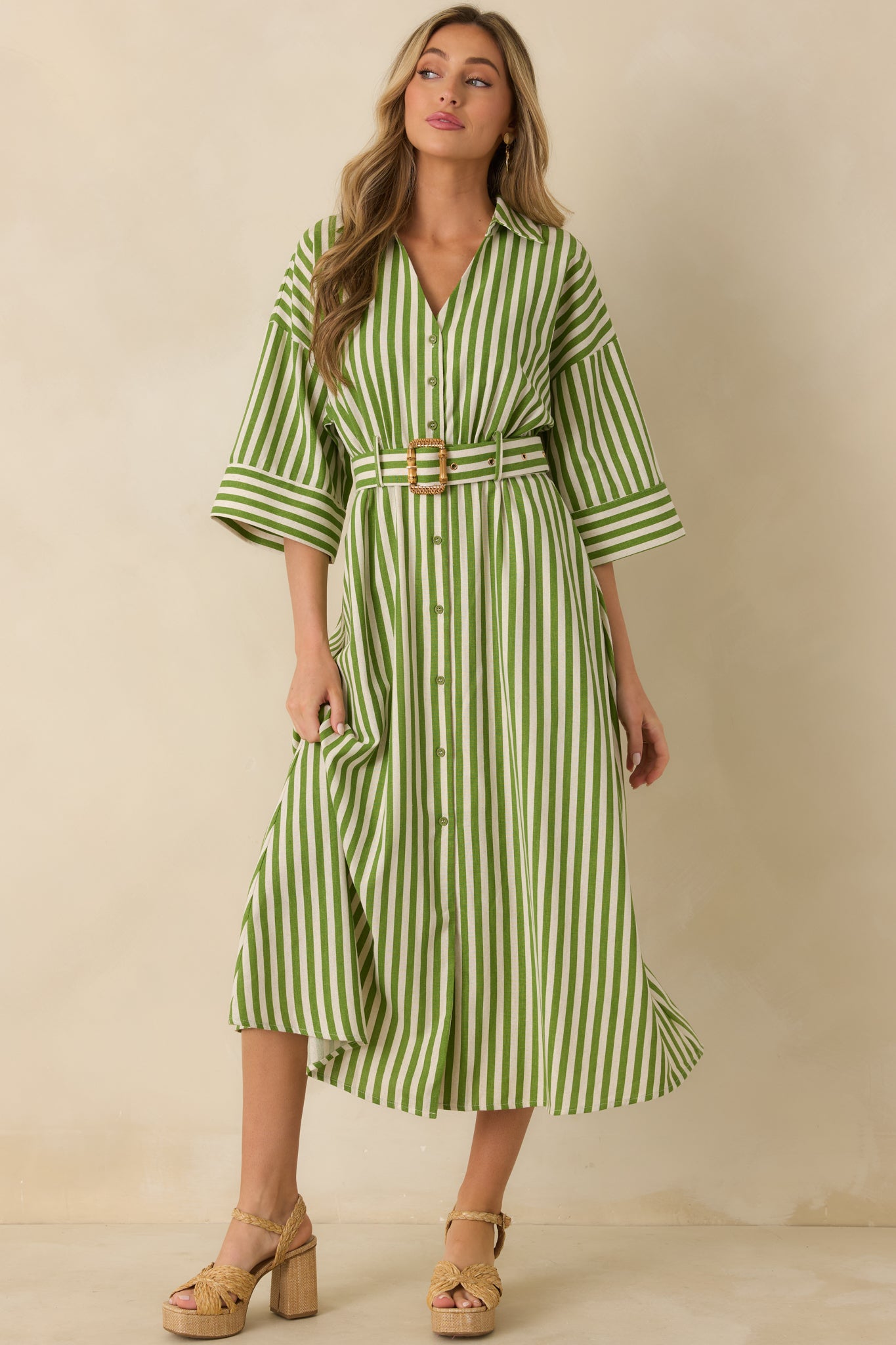 Flowing green striped maxi dress with structured collared neckline and airy woven texture throughout