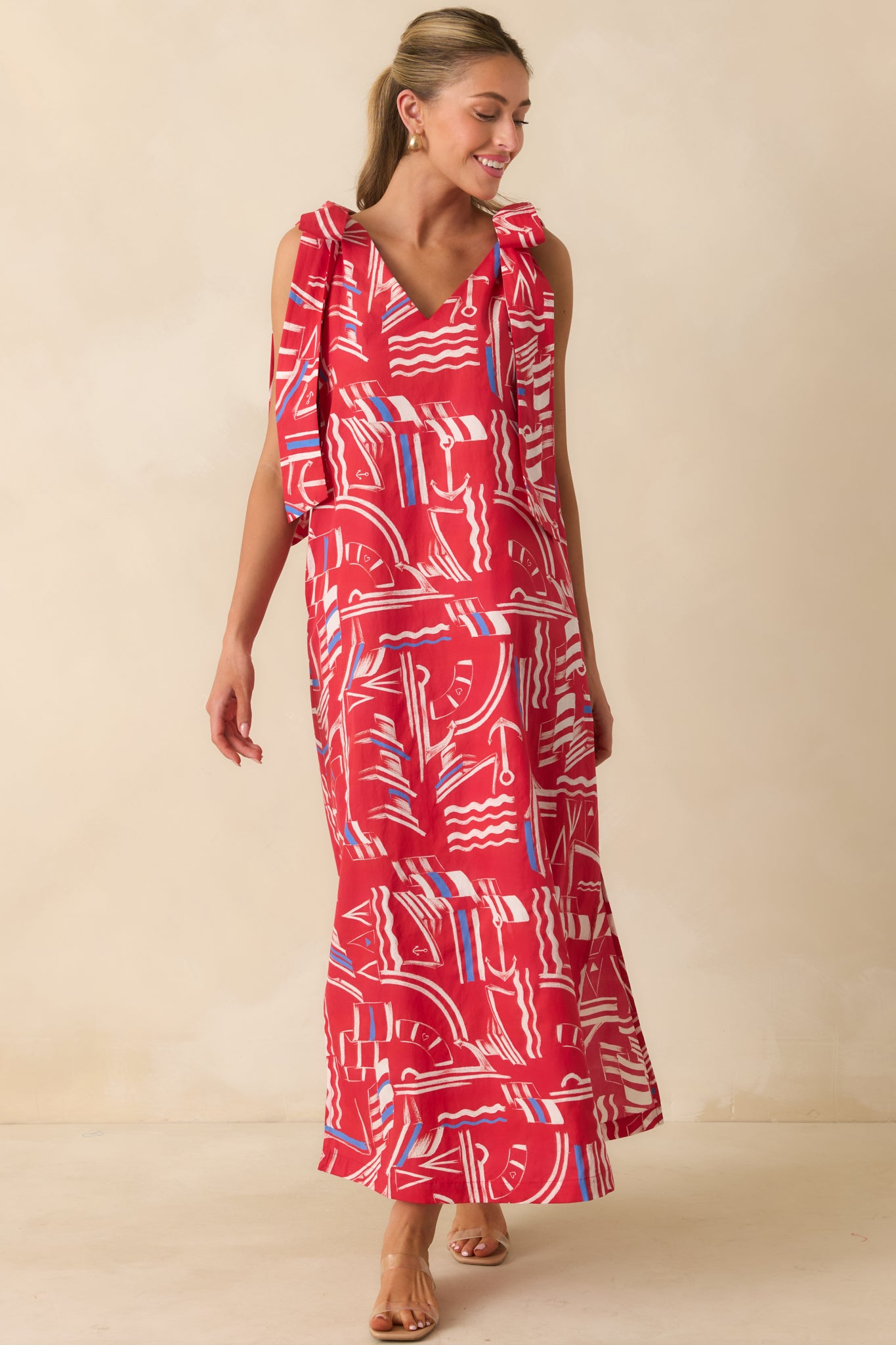 Flowy yacht club print dress featuring a relaxed fit, functional pockets, oversized shoulder bows, and lightweight cotton fabric.