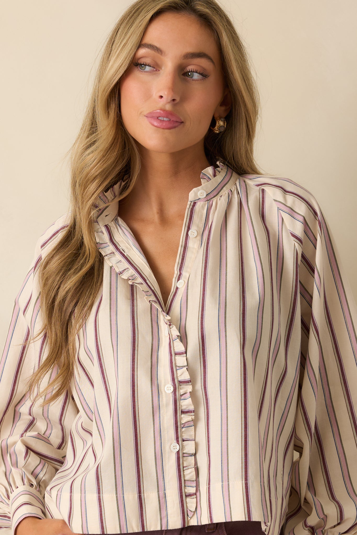 Focus on the balloon sleeve and cuff detailing, highlighting the soft woven fabric and subtle stripe pattern.