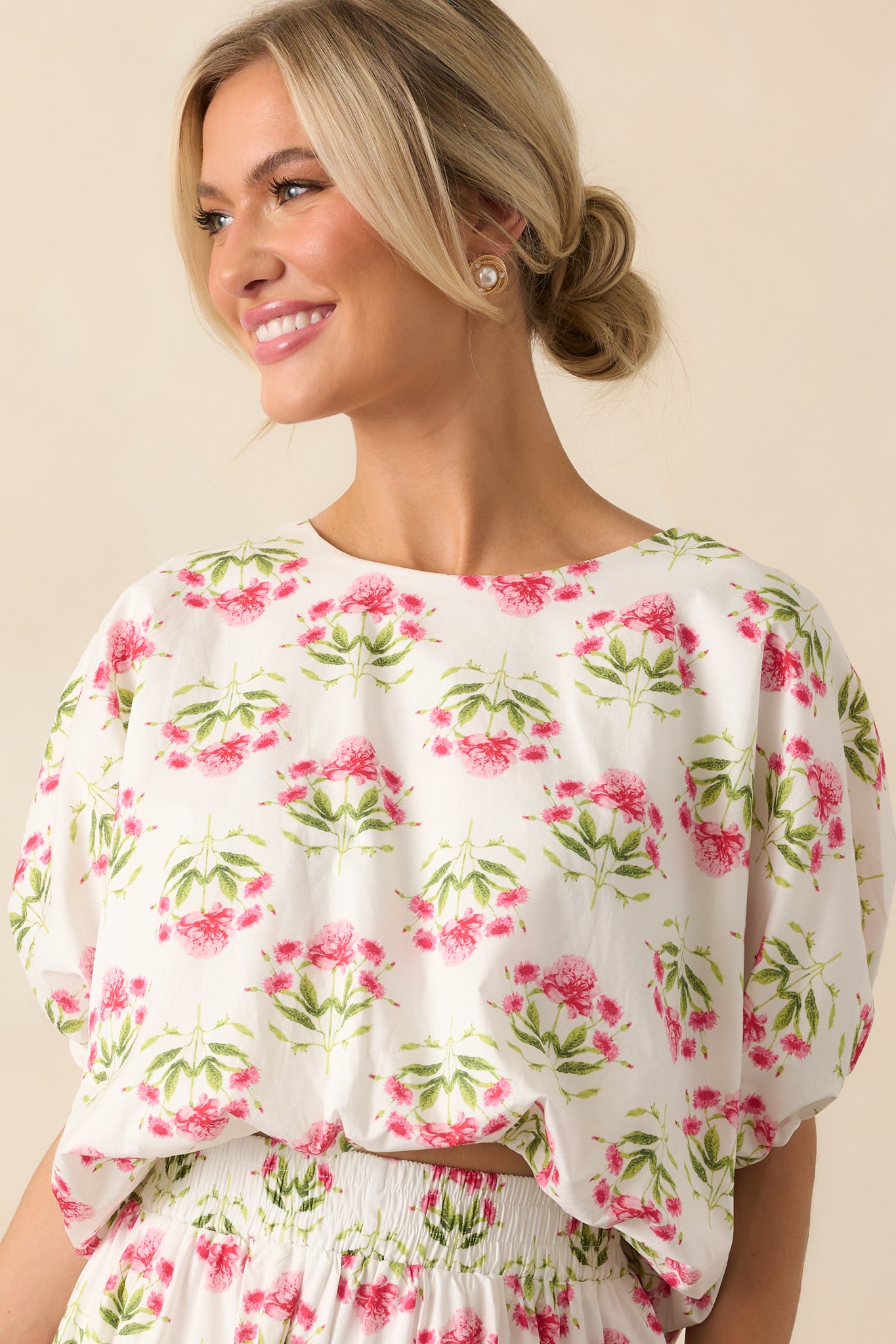 Focused image of the shoulder and upper sleeve area, showcasing the puff shape and floral detailing.