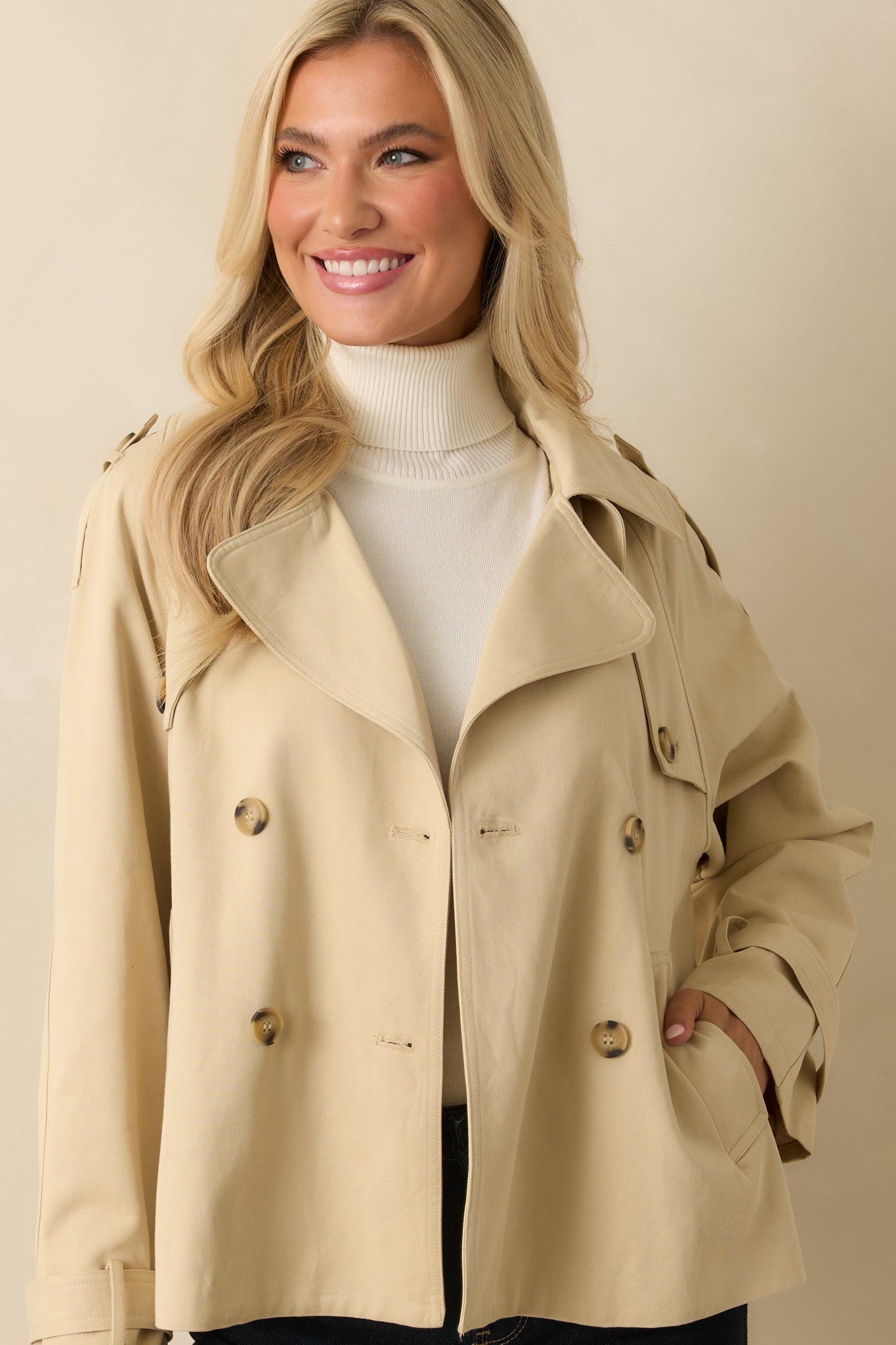 Focused look at the sleeve cuff detail and structured shoulder epaulets.