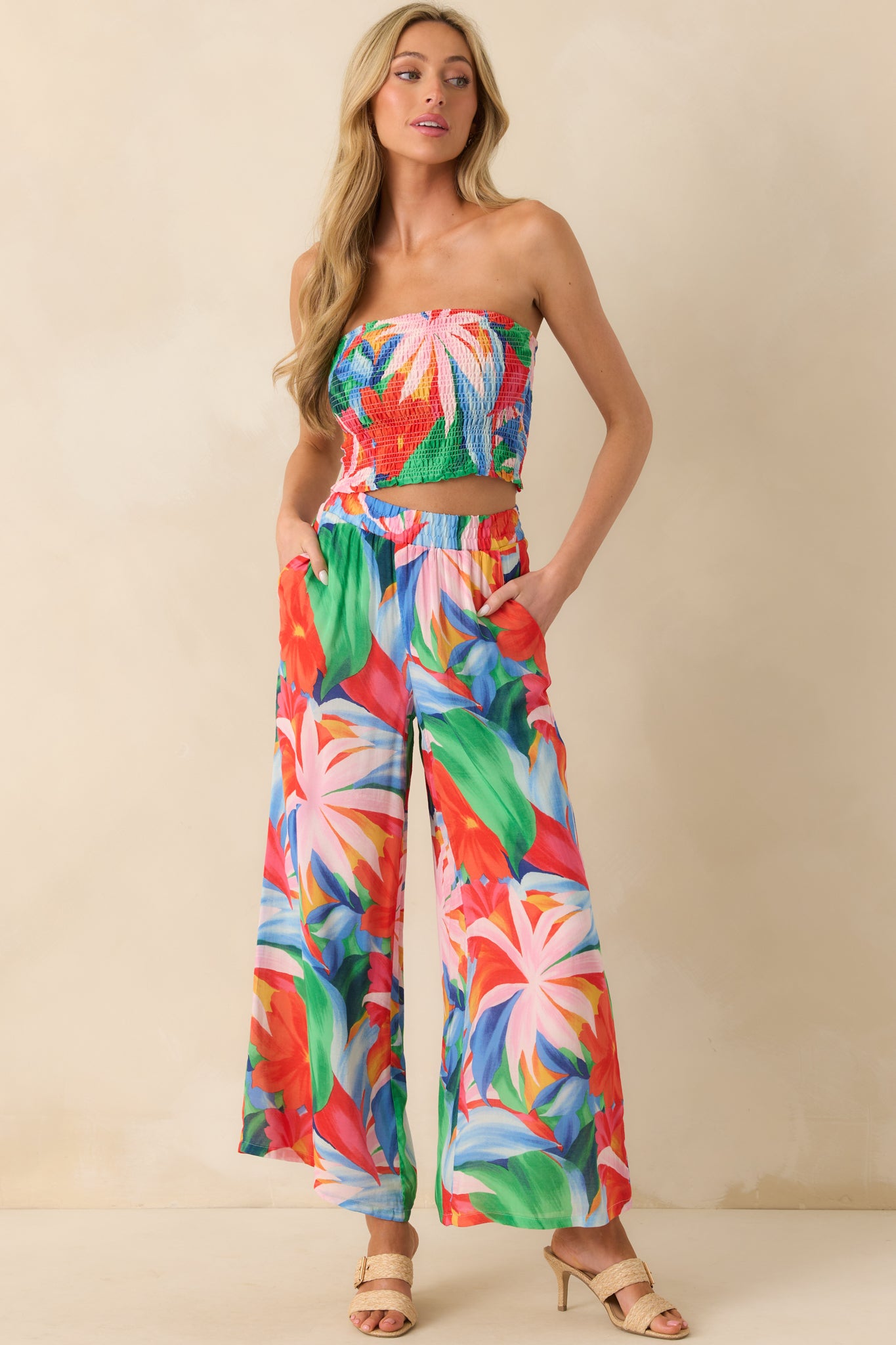 Mid-leg cropped shot focusing on the wide-leg shape and the bold, colorful floral detailing throughout the fabric.