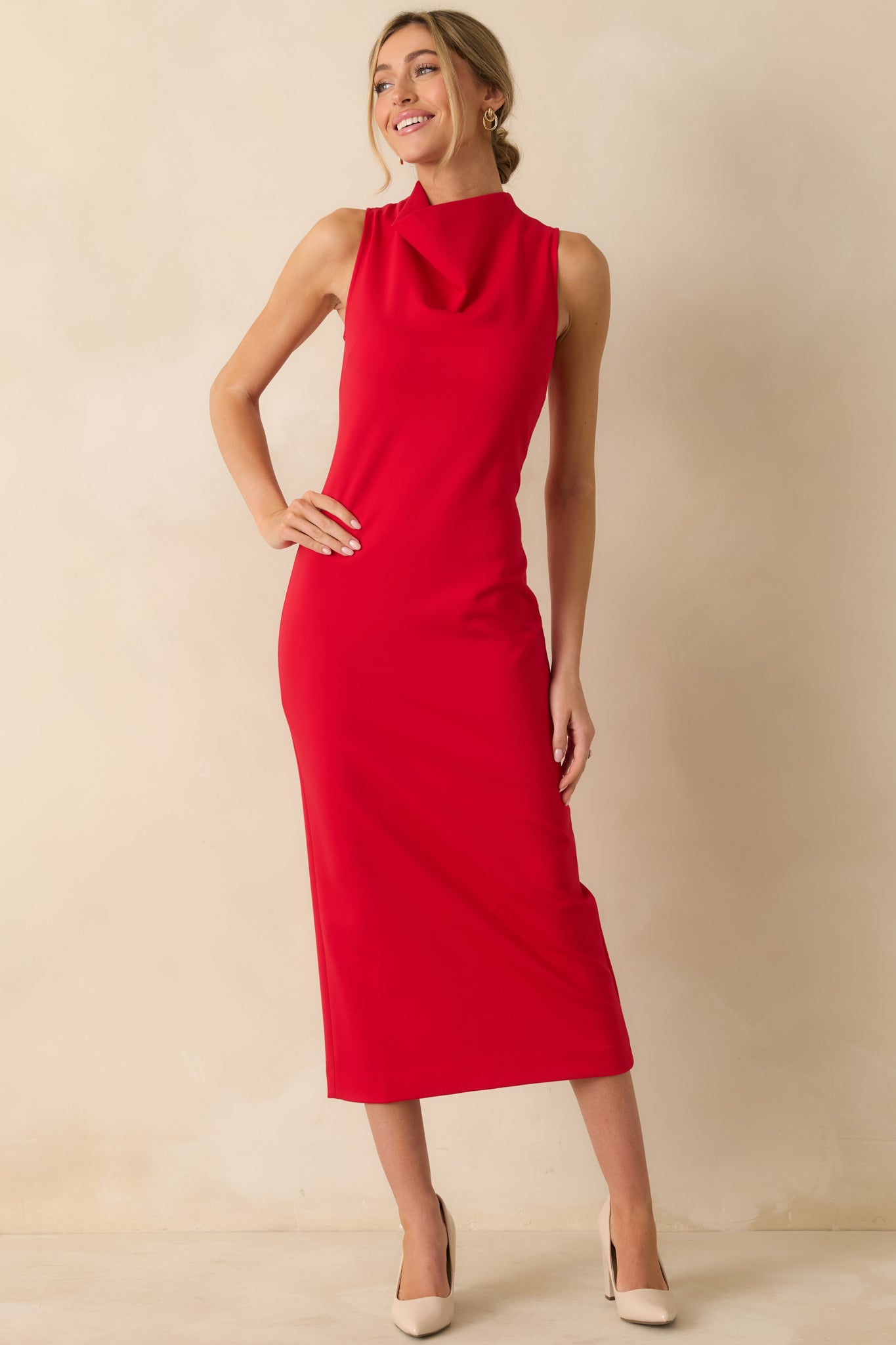Form-fitting red sleeveless dress with a bodycon cut and high neckline, designed for a streamlined, figure-shaping silhouette.