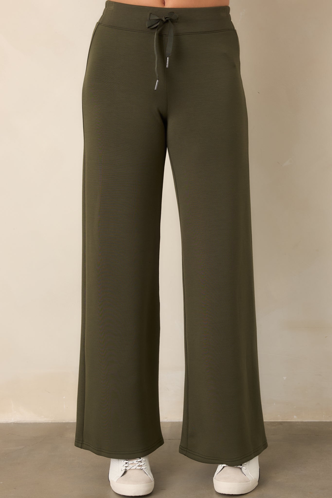 Four-way stretch pants featuring a comfortable pull-on waist and generously cut wide legs that drape with effortless movement.
