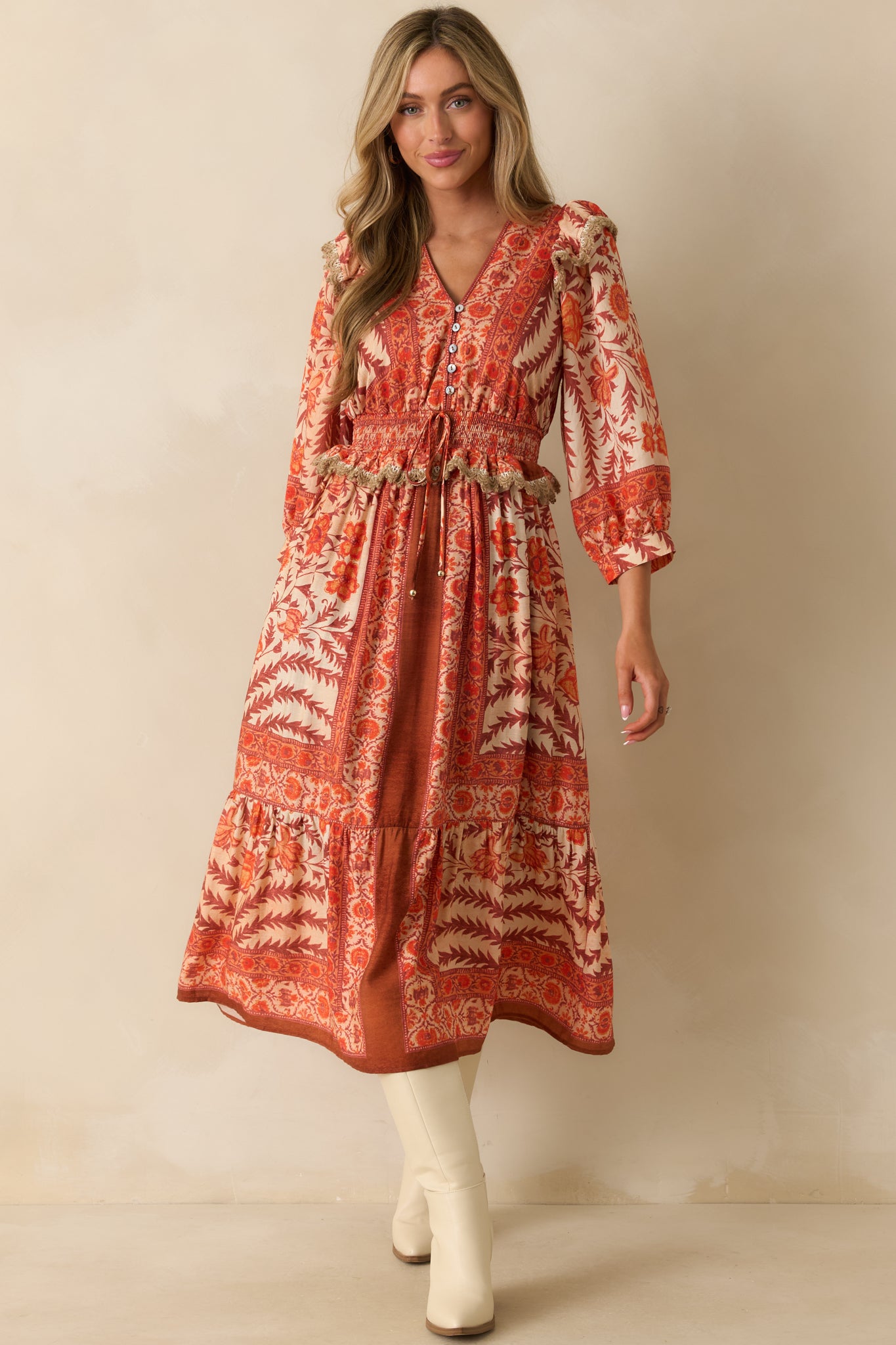 Full body front angle showing the 3/4 length sleeves with elastic cuffs and ruffle trim detailing.