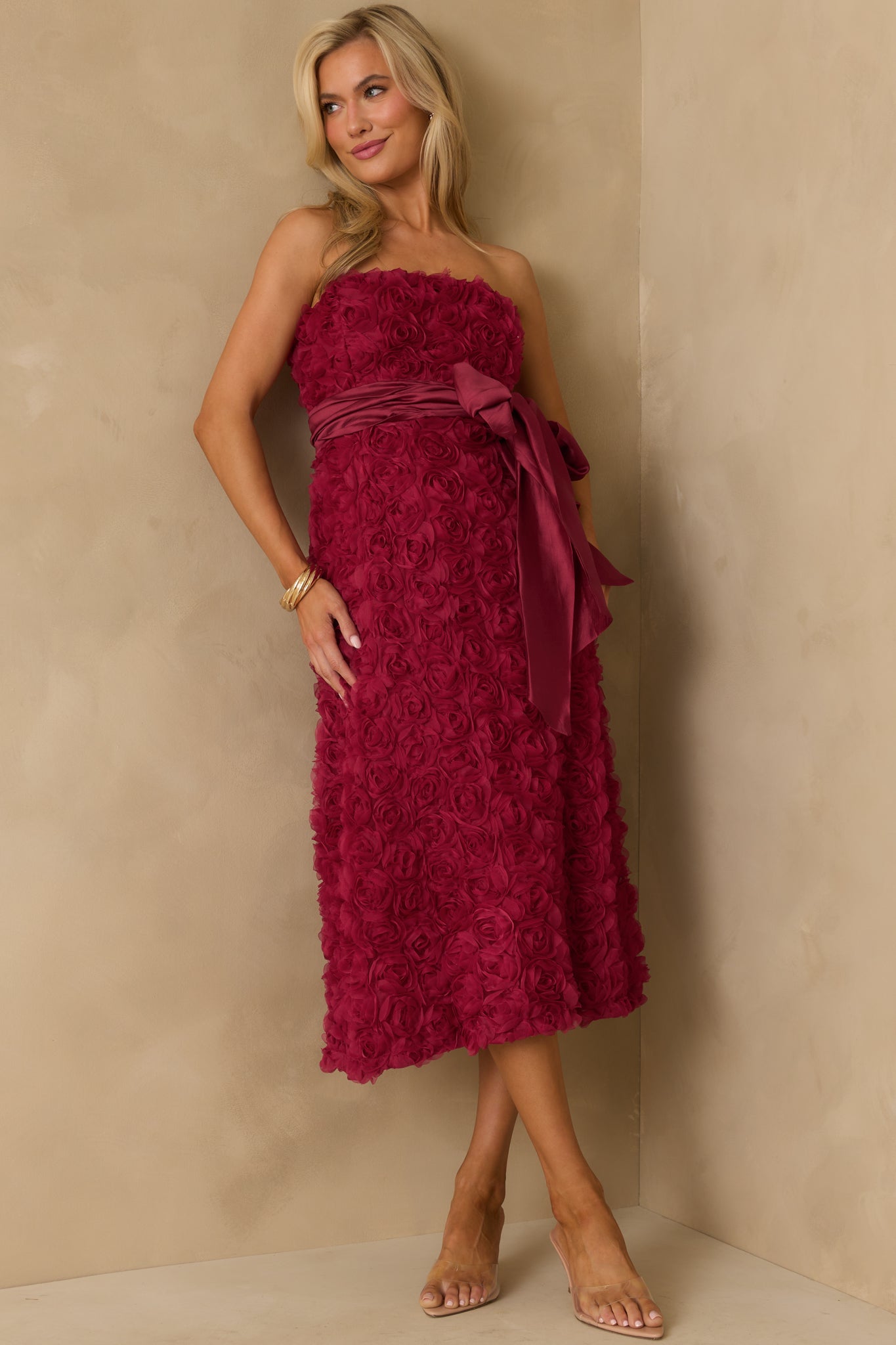 Front angle displaying the bow tie waist and textured floral applique design.