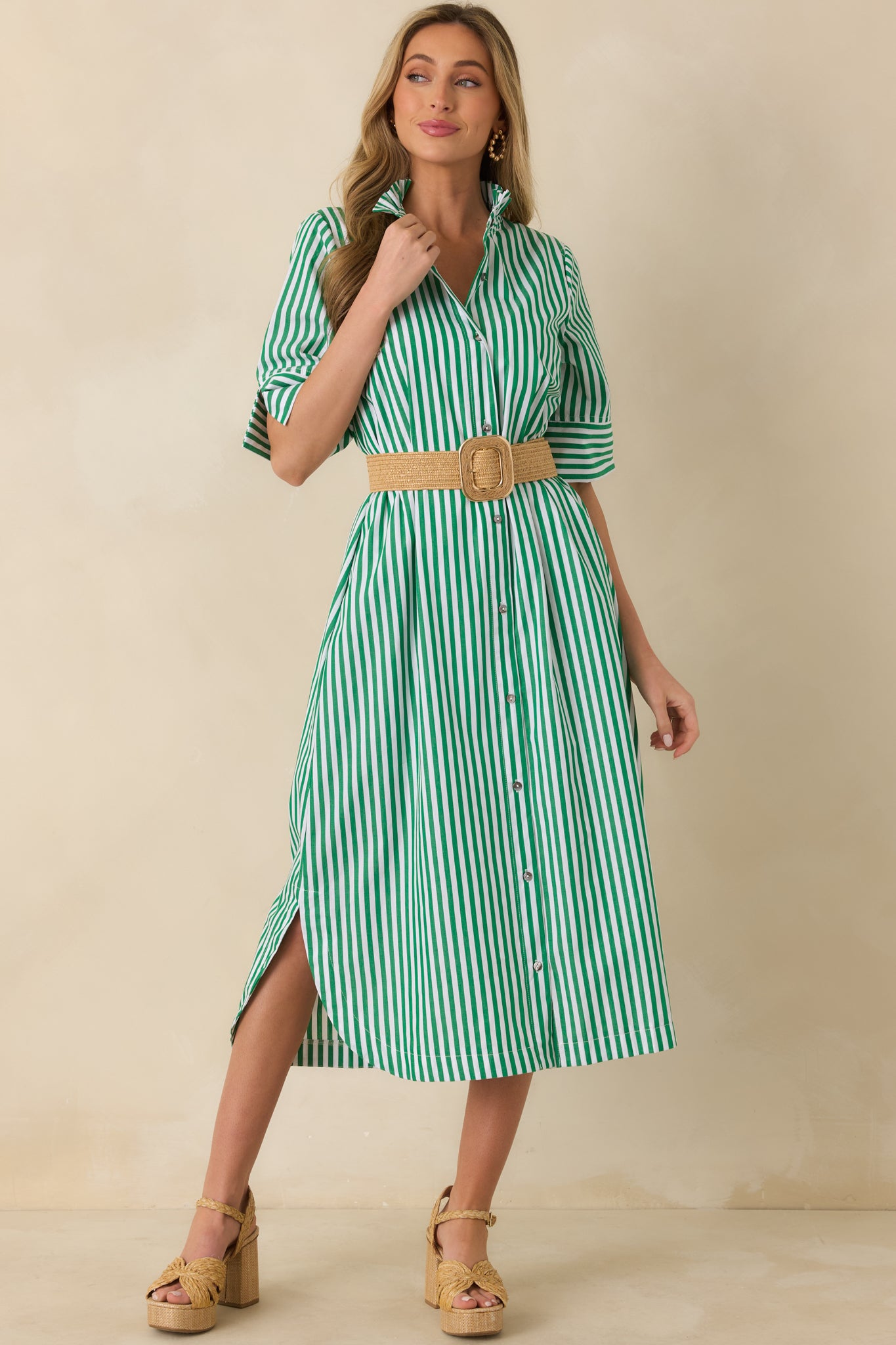 Front angle of green striped shirt dress showcasing the vertical stripe pattern and easy silhouette.