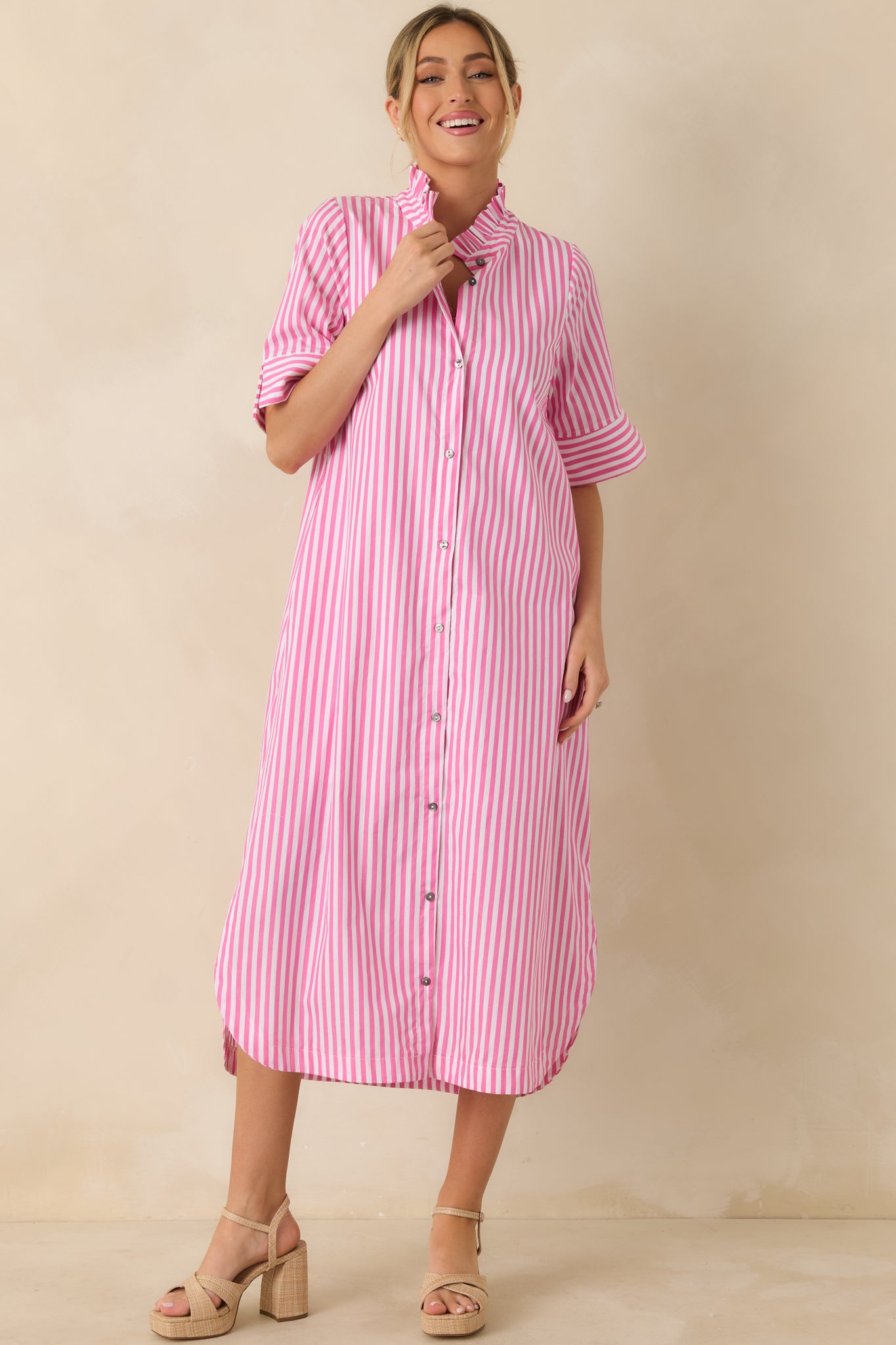 Front angle showcasing the pink striped pattern and shirttail hemline detail.
