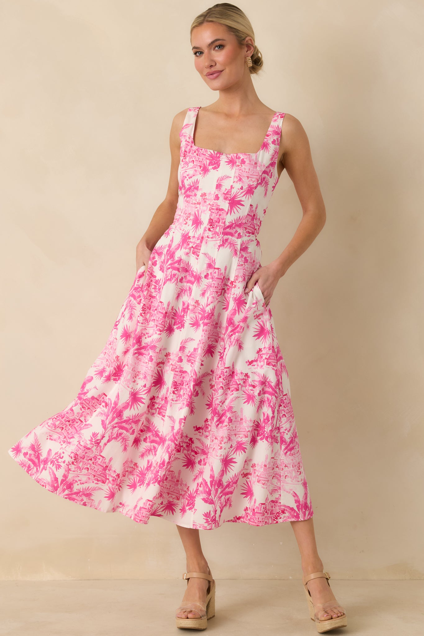 Straight-on front angle showing the flowing midi-length skirt and structured bodice with seam detailing.