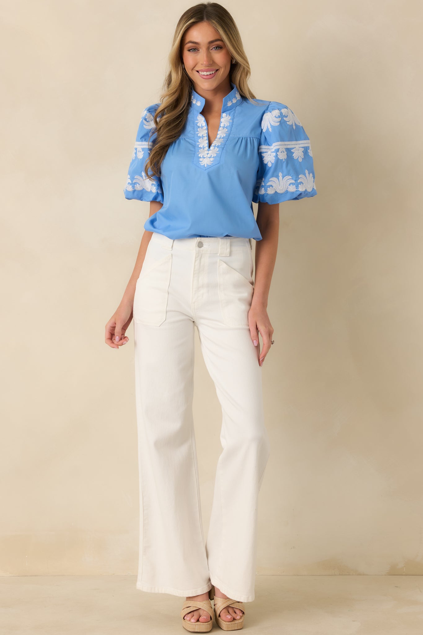 Straight-on front angle showing the smooth fabric texture, short puff sleeves, and easy silhouette.