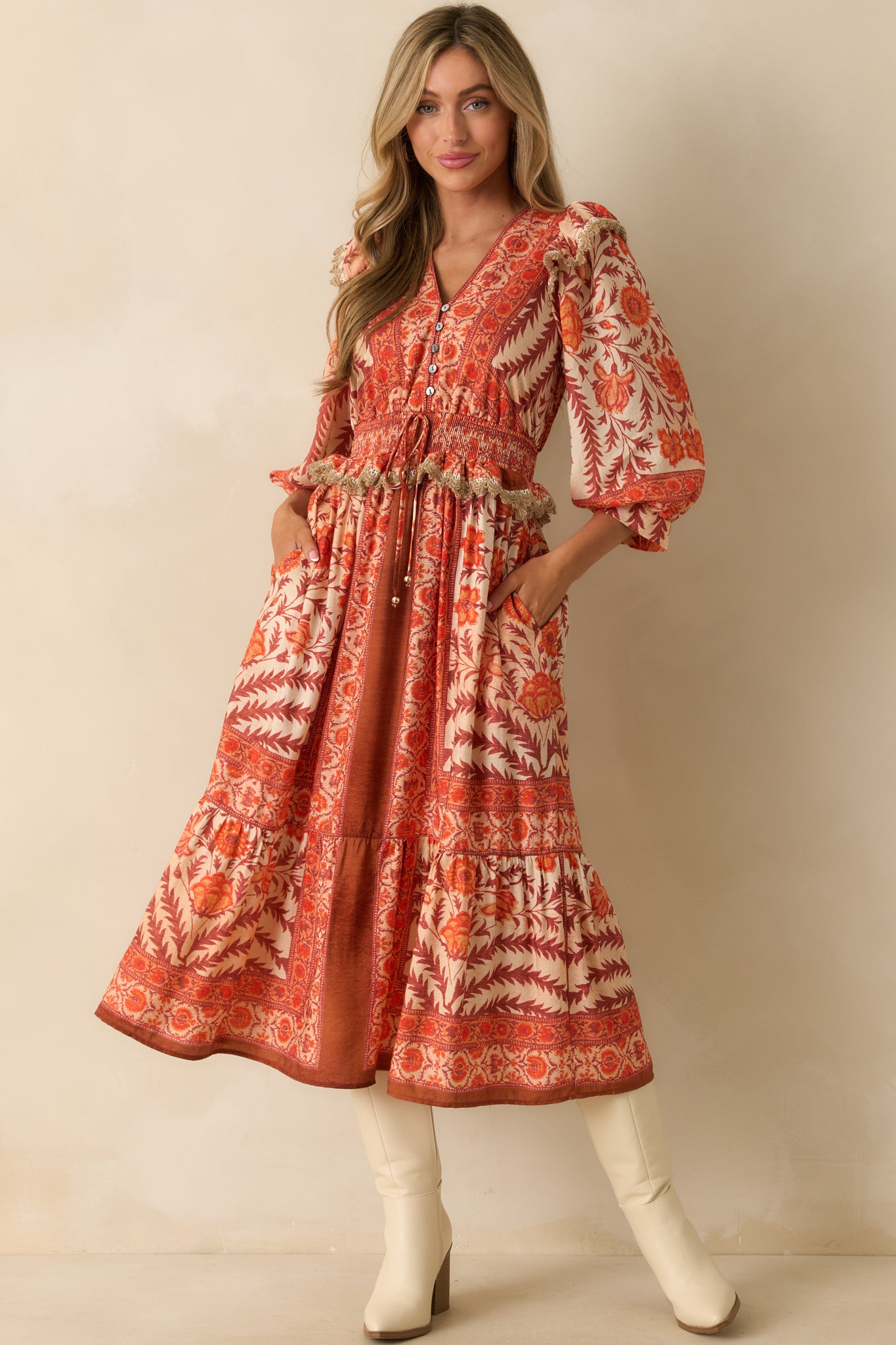 Full body close front angle focusing on the v-neckline and structured bodice design with floral patchwork.