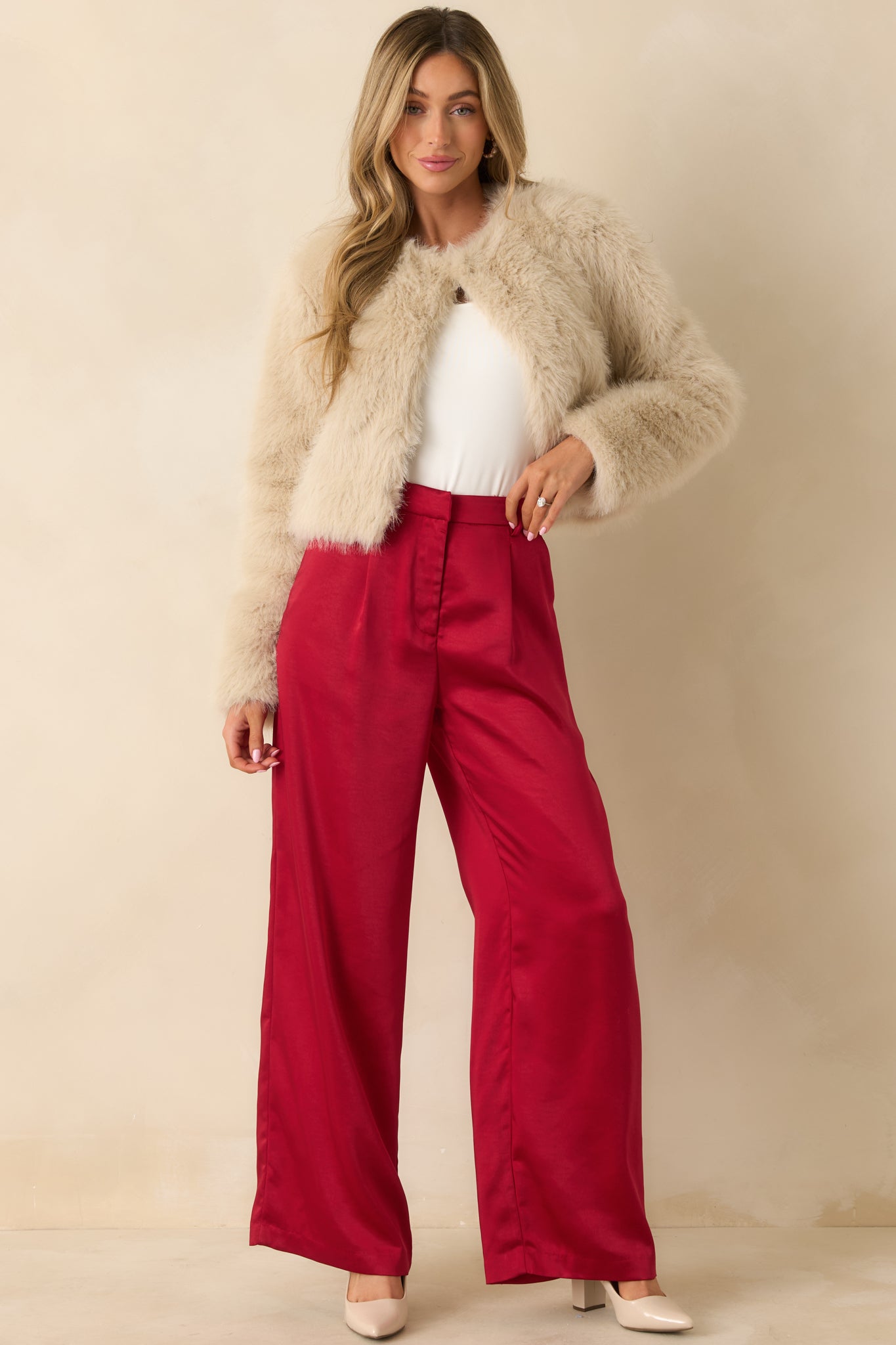 Front view of a plush cream cropped jacket highlighting its soft texture and casual silhouette.