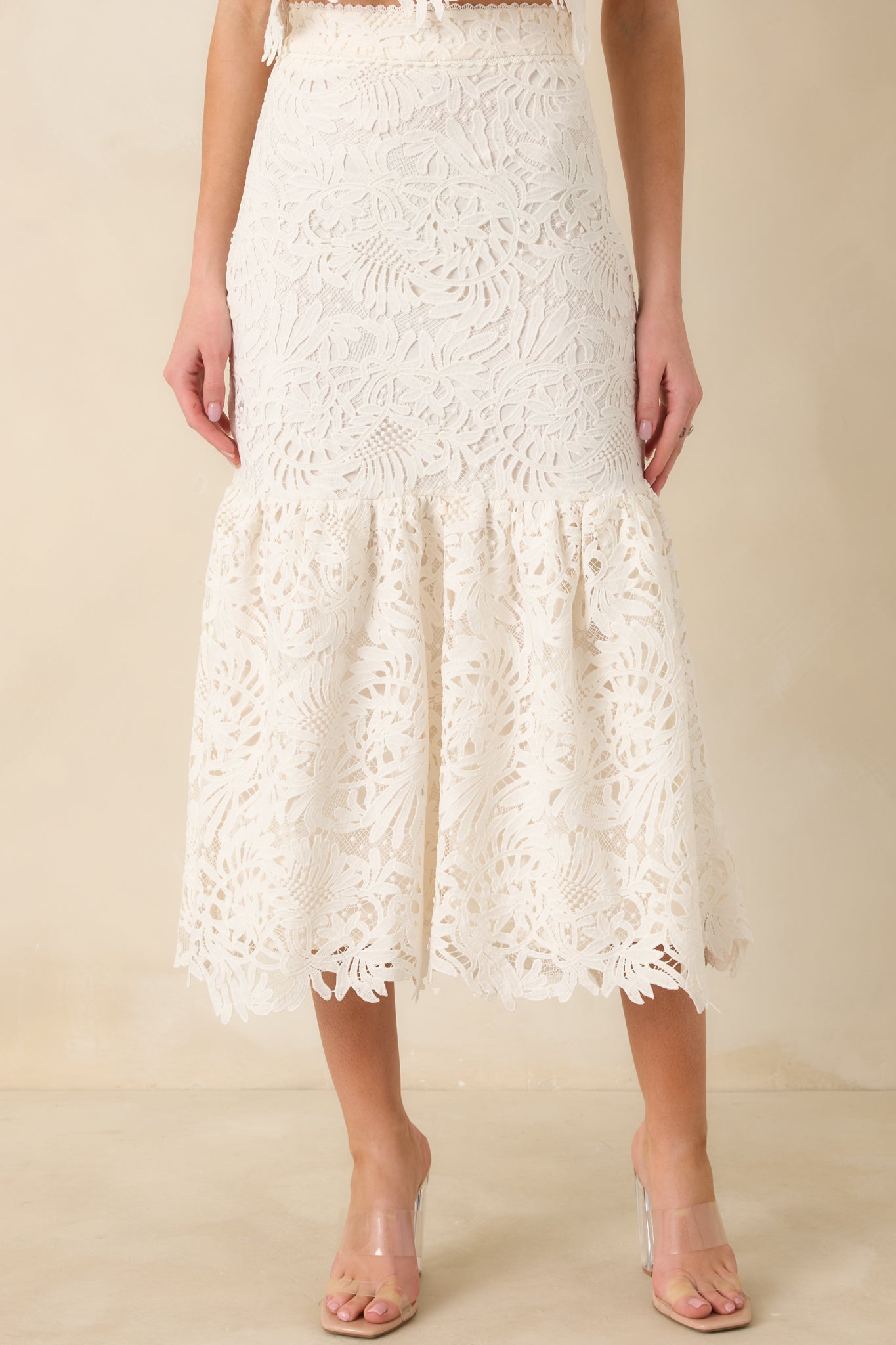 Cropped front view focusing on the fitted high waist and intricate floral lace texture.