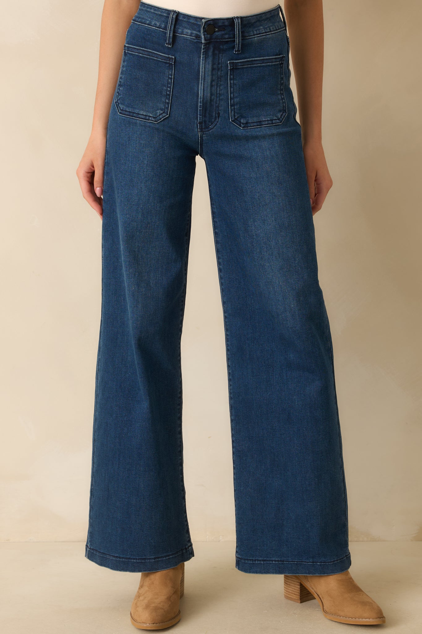 Front crop emphasizing straight-leg cut and smooth dark wash denim texture.