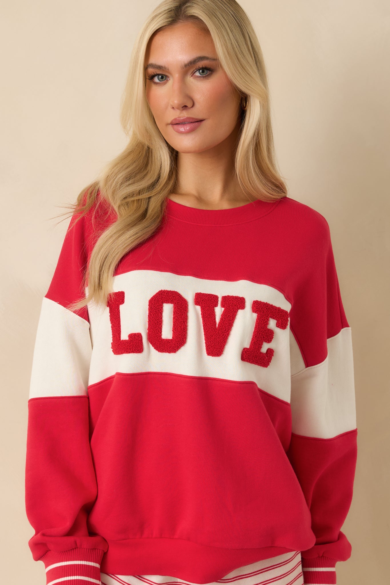 Front-focused detail highlighting the “LOVE” lettering and contrasting ivory panels