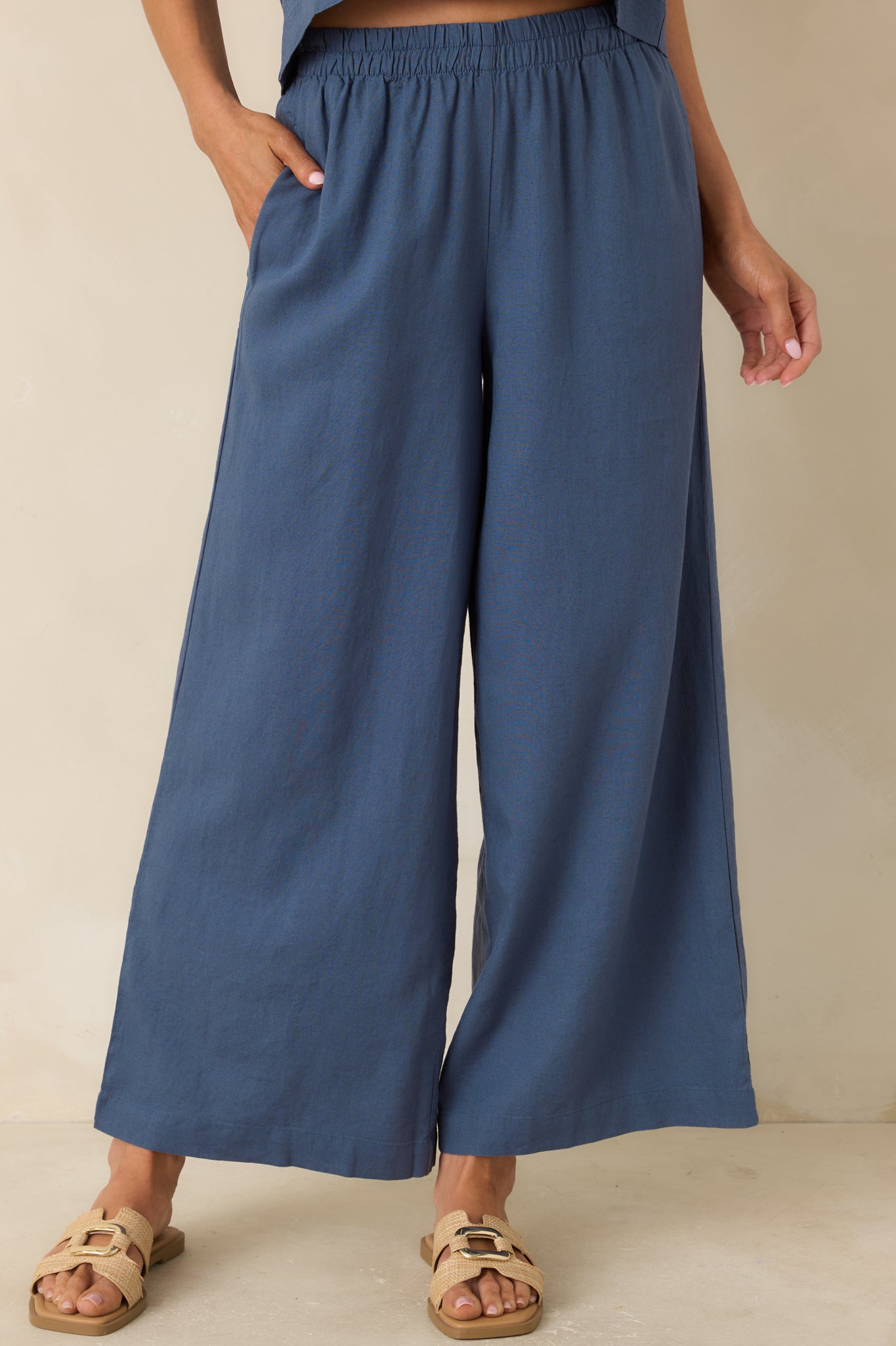 Front detail of vintage indigo pants showcasing wide-leg silhouette and soft breathable texture.