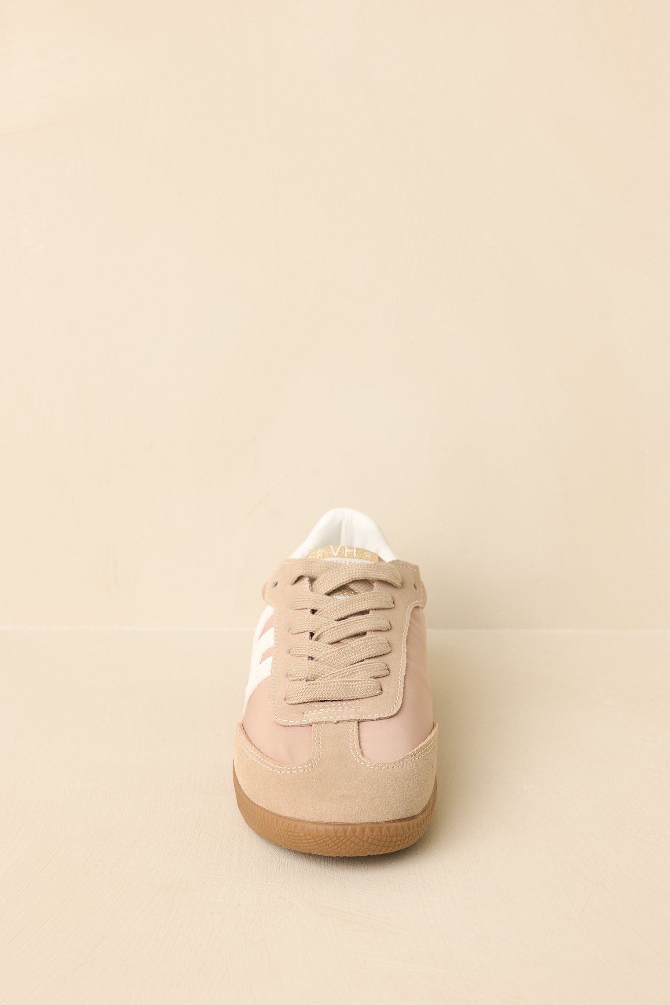 Front-facing angle emphasizing the rounded toe, lace-up closure, and balanced proportions.