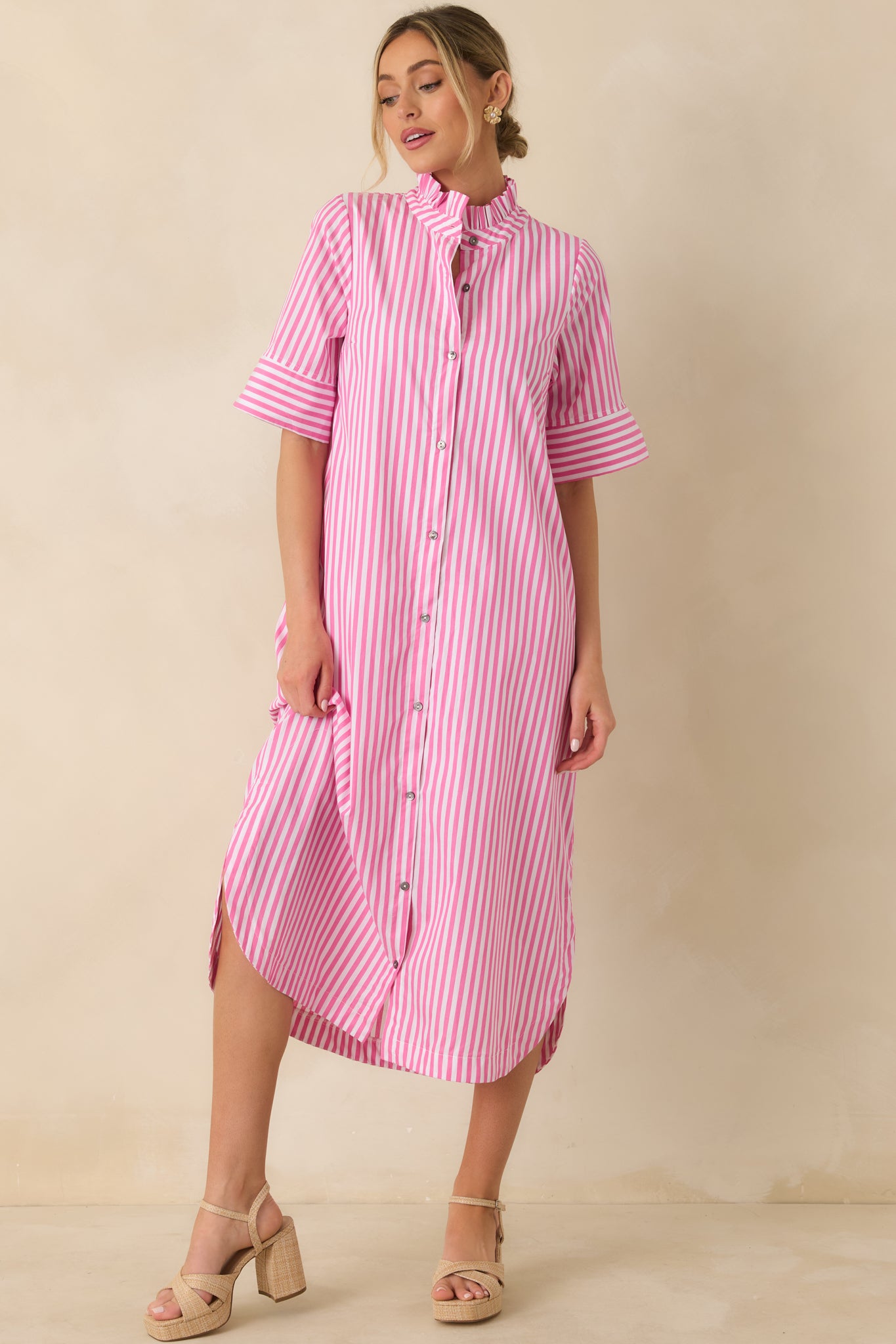 Front-facing image highlighting the button-front design and vertical stripe pattern.