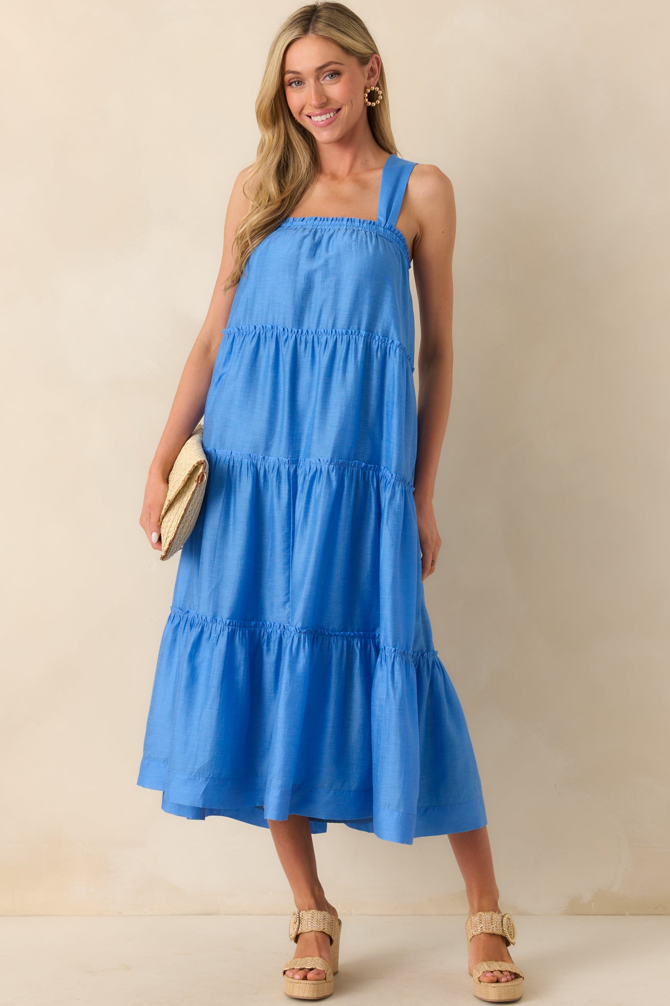 Front-facing full body shot displaying the dress’s structured square neckline, draped ruffle tiers, and comfortable relaxed silhouette.