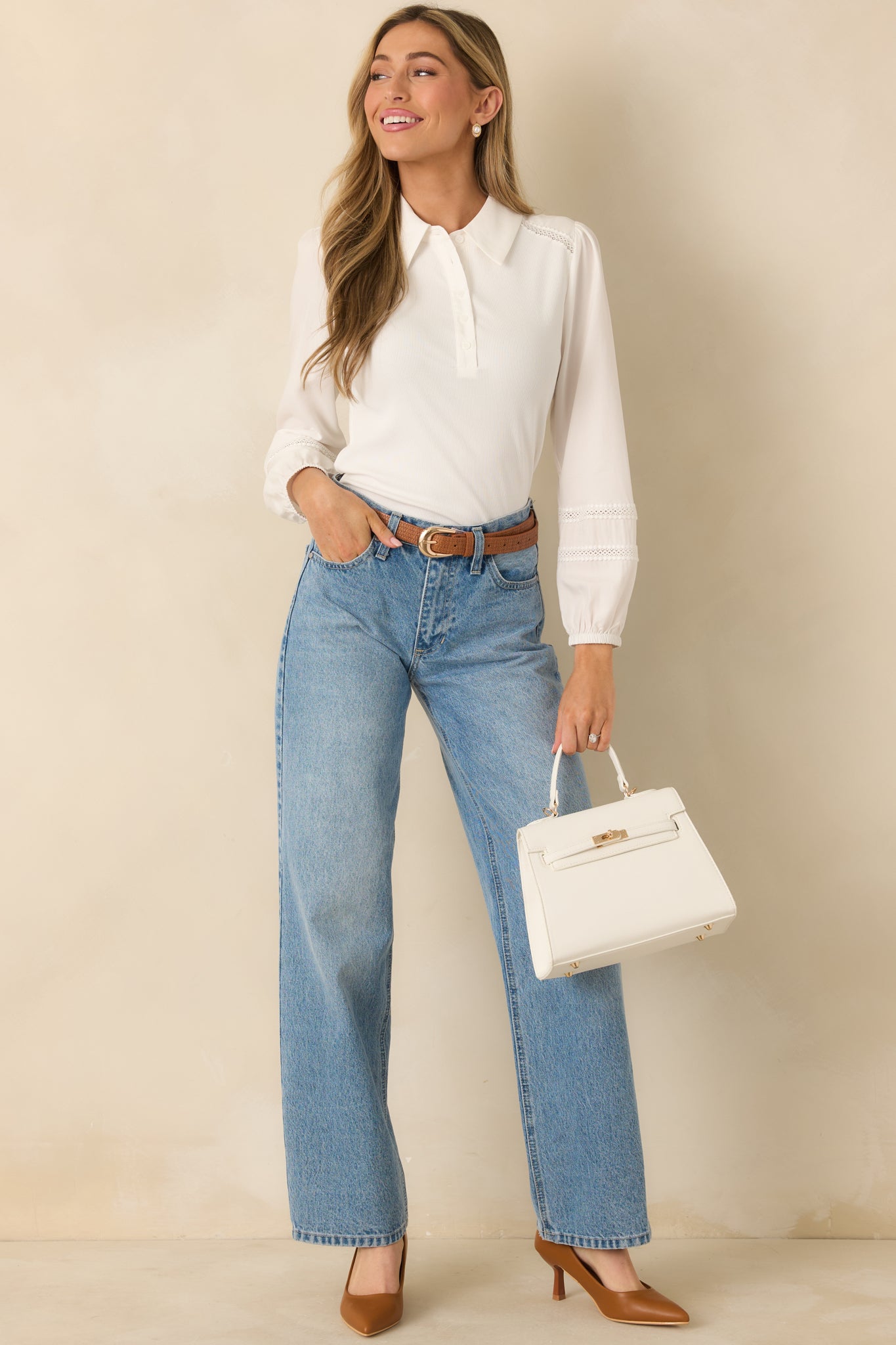 Front-facing image of white ribbed top with lace detailing and collared neckline, designed in a sleek, comfortable fit.