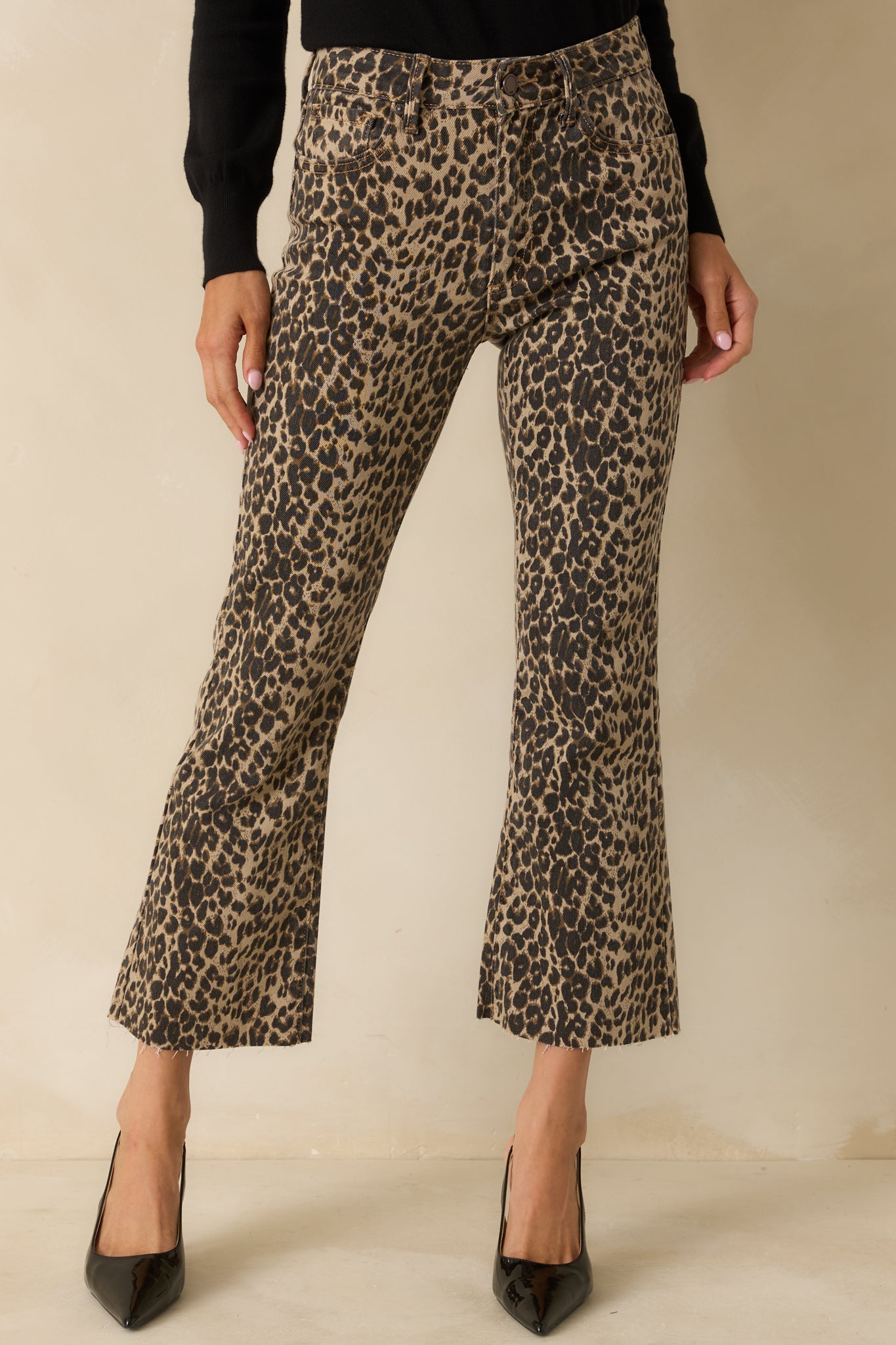 Front-focused shot showing the high-rise fit and textured leopard print.
