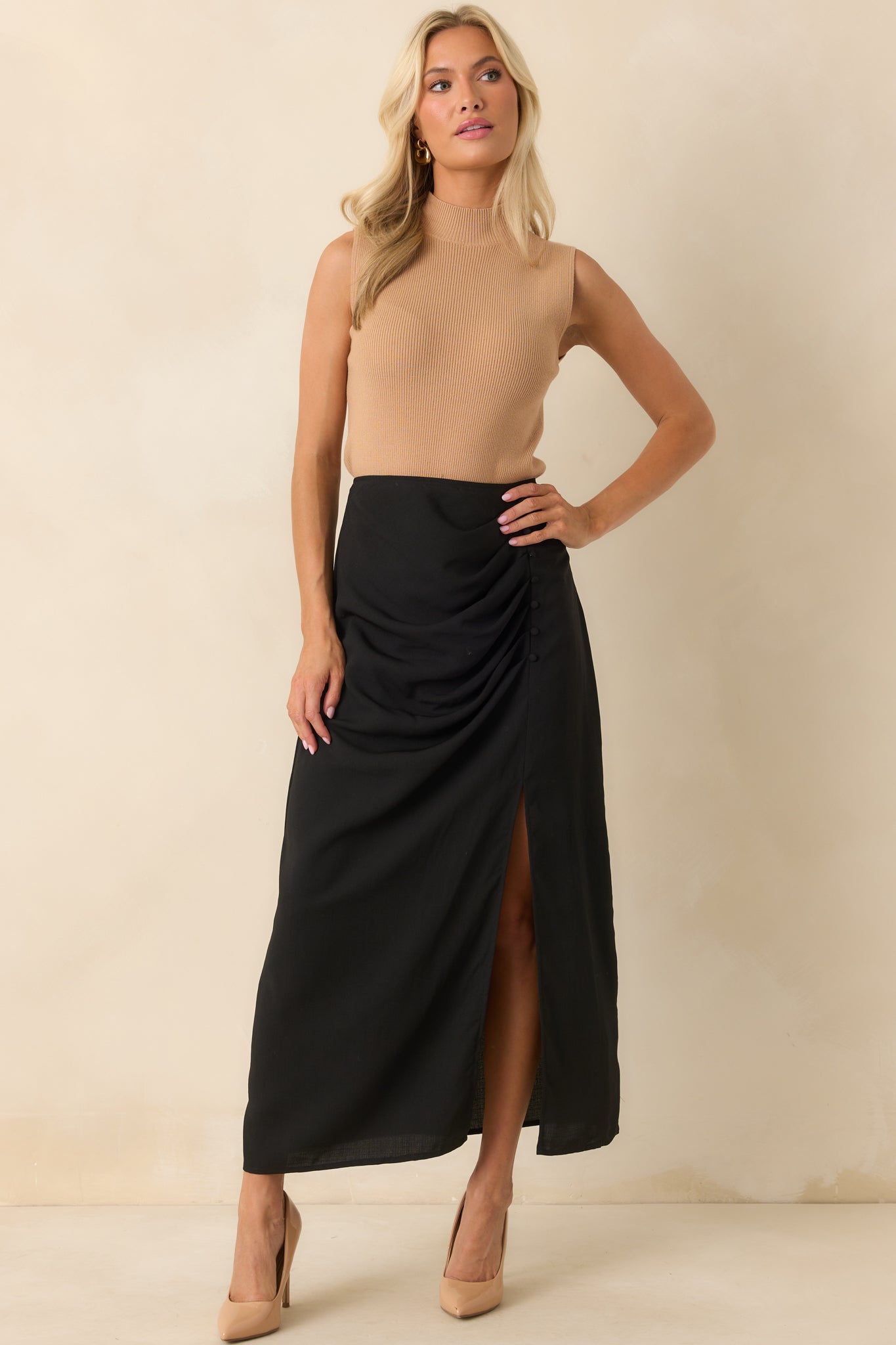 A front full body shot highlighting the mock neckline and ribbed texture of the top.