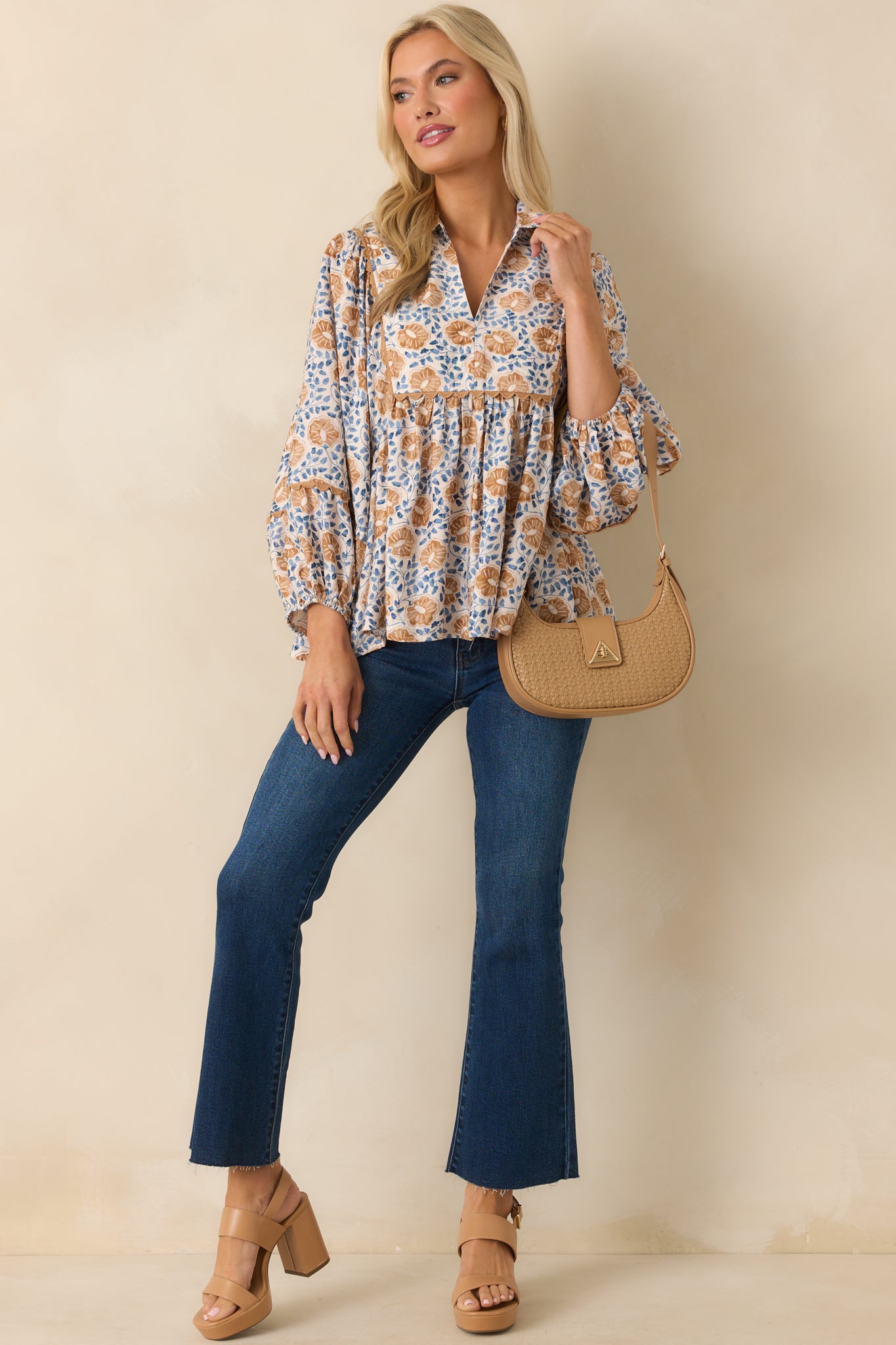 Front-facing full length image highlighting the long sleeves with elastic cuffs and relaxed fit.