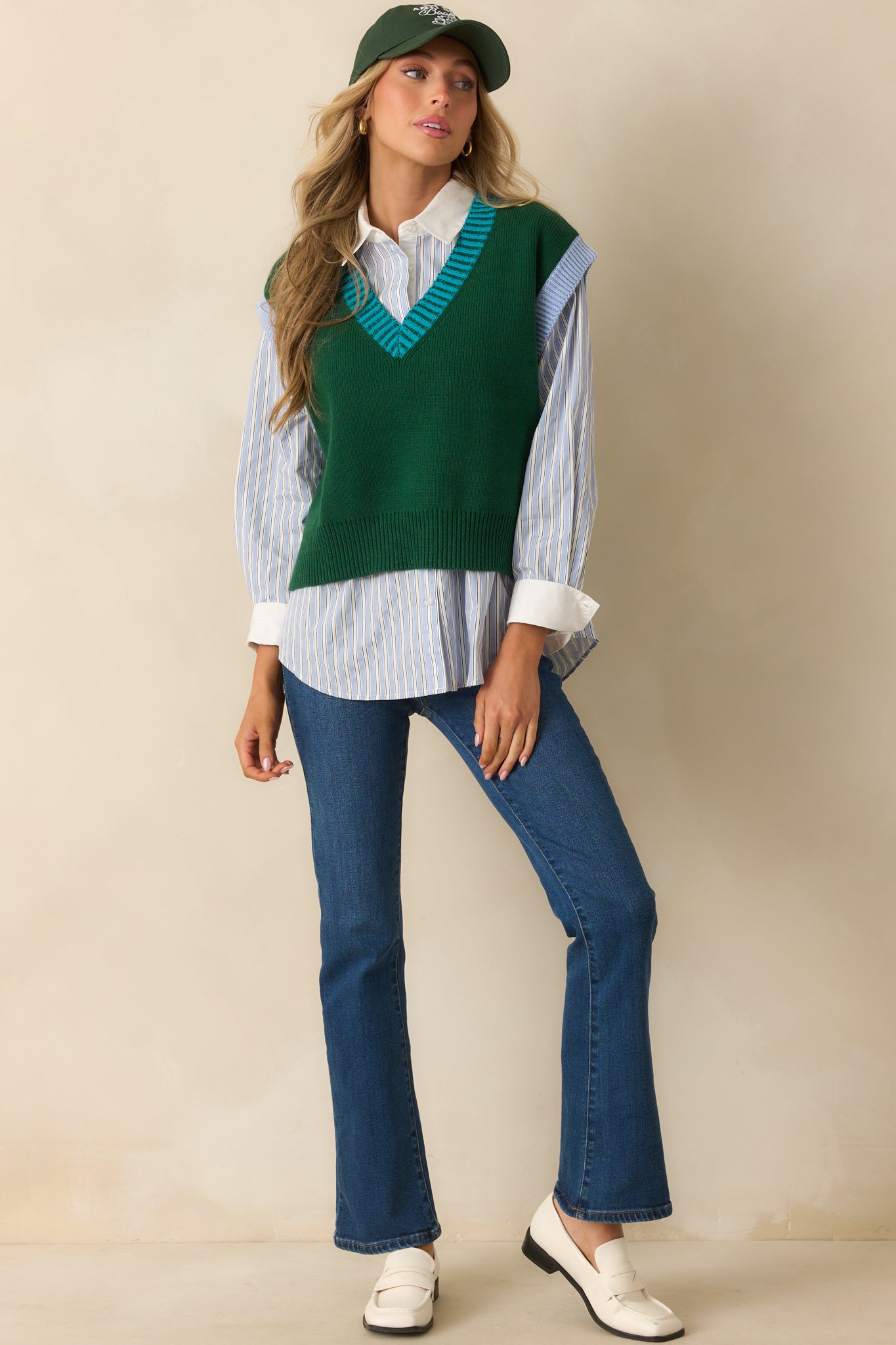 A front-facing full length view showing the ribbed neckline trim and easy drape of the vest.