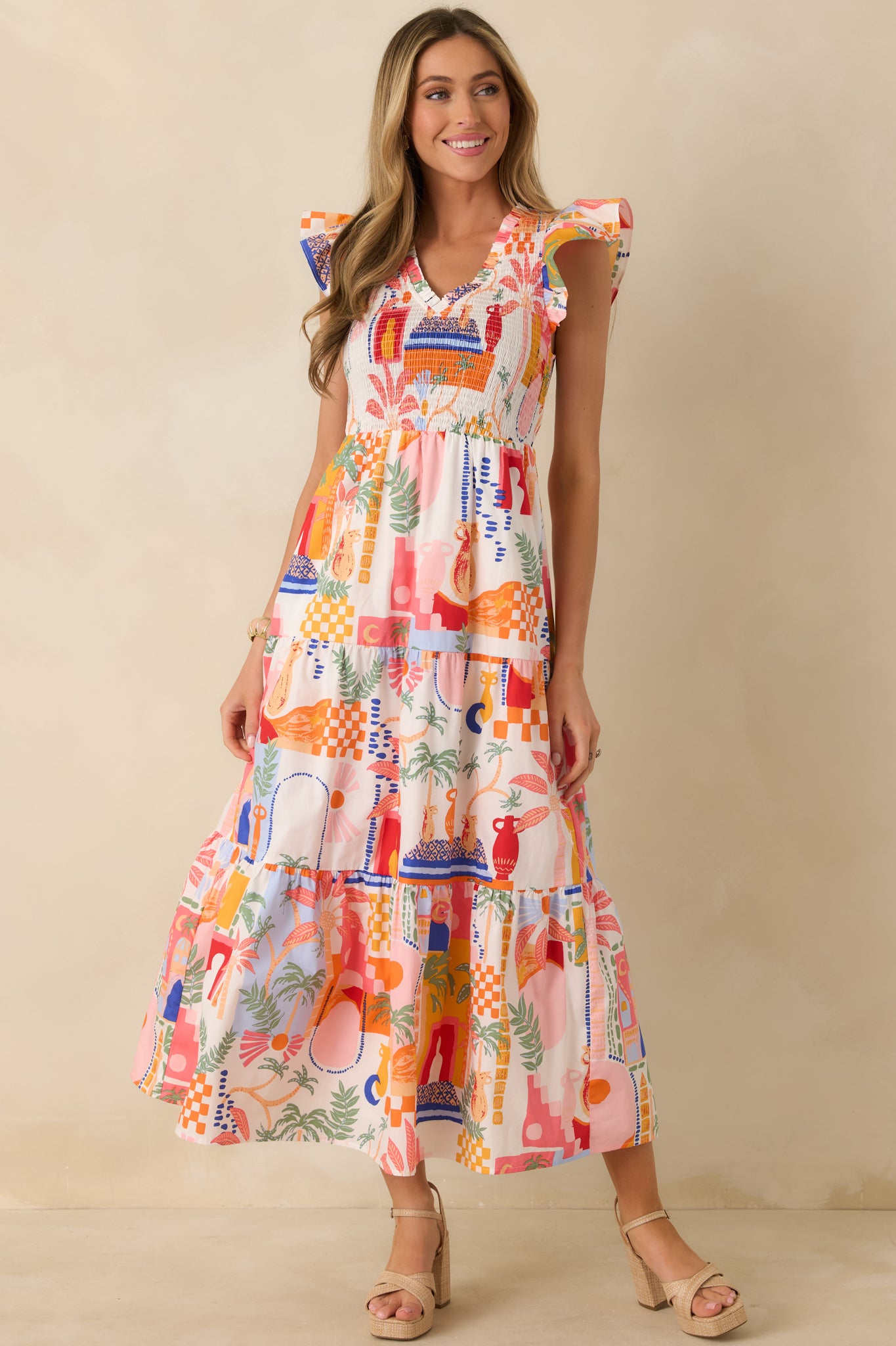 Angled front perspective highlighting the tiered skirt and flowy silhouette of the cotton maxi dress.