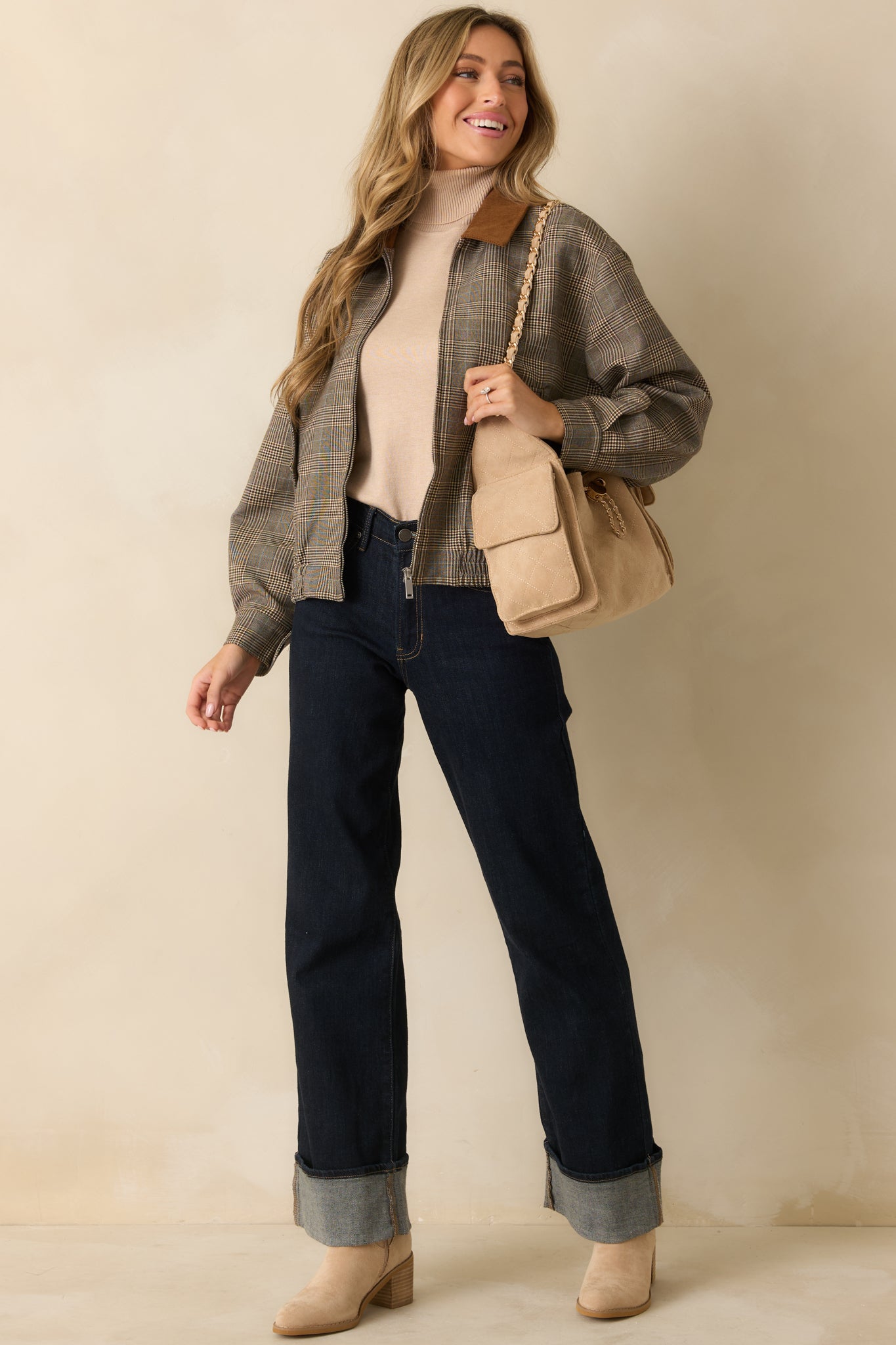 Front view of the plaid bomber jacket highlighting elastic hem, zip closure, and corduroy collar.