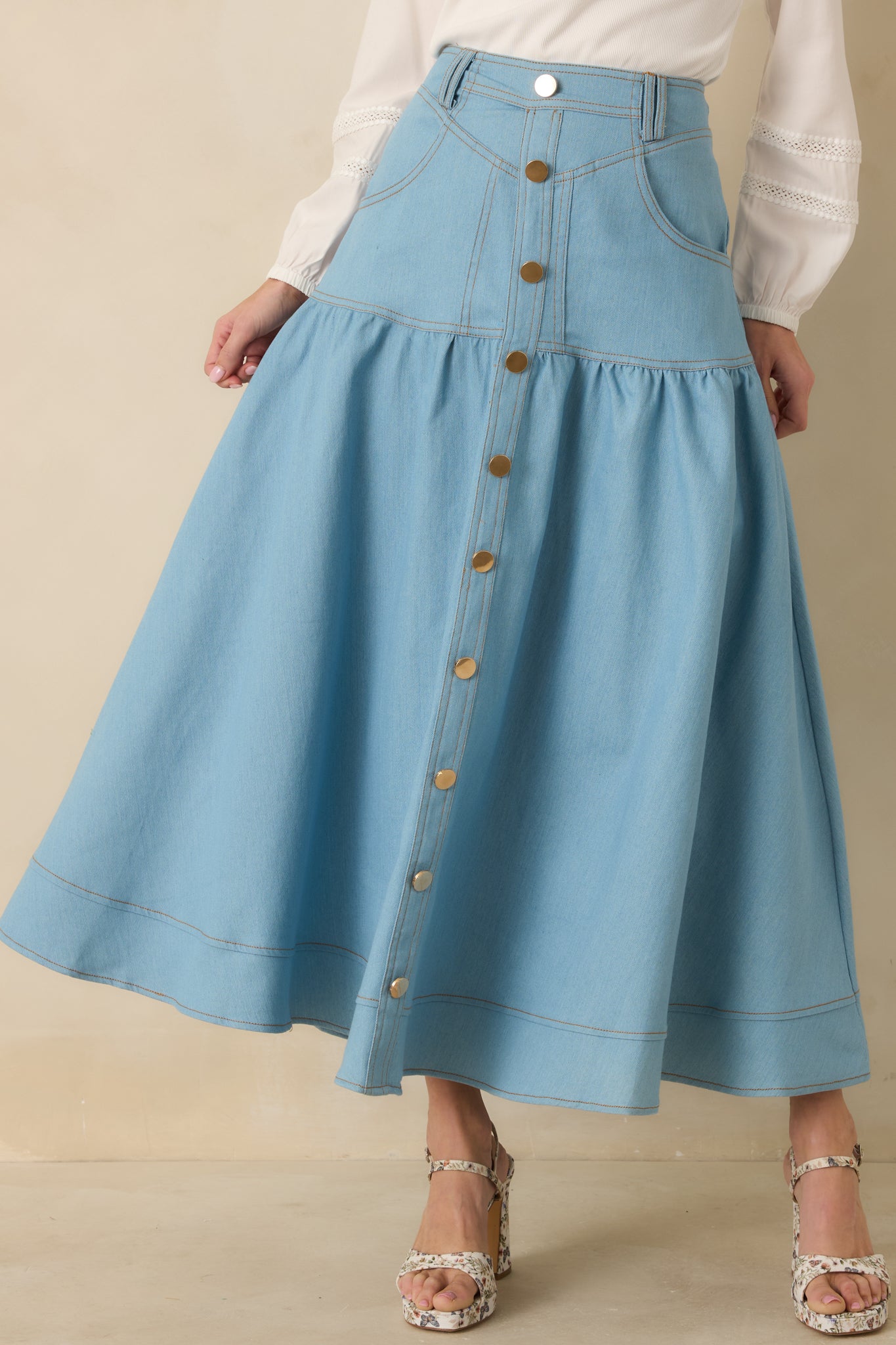 Front pocket and button placket detail highlighting the structured denim fabric.