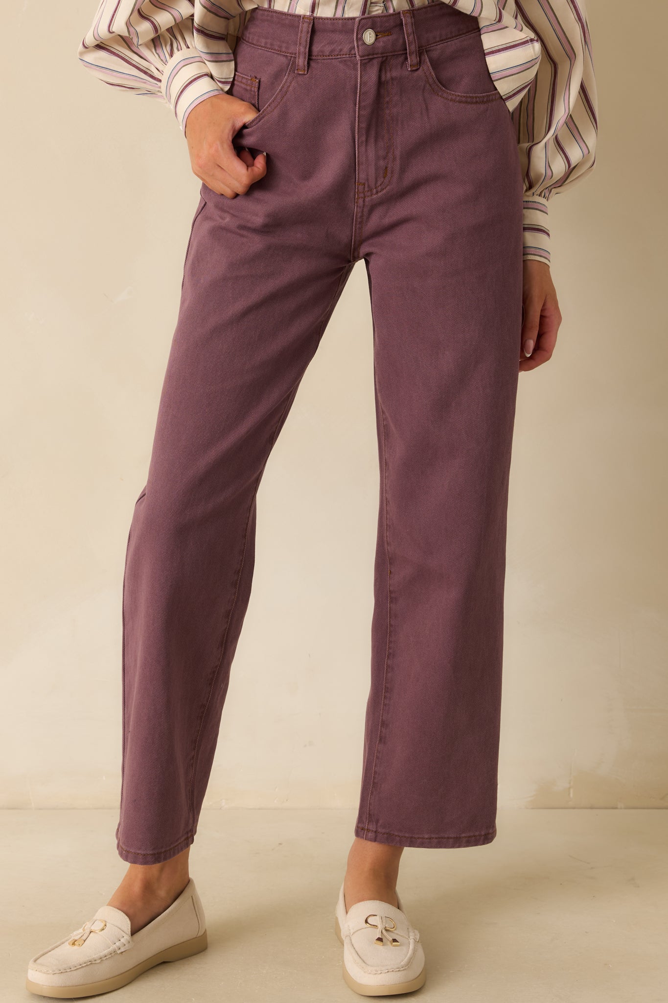 Focus on the front pocket area and top section of the straight-leg violet denim, showing stitching and structure.