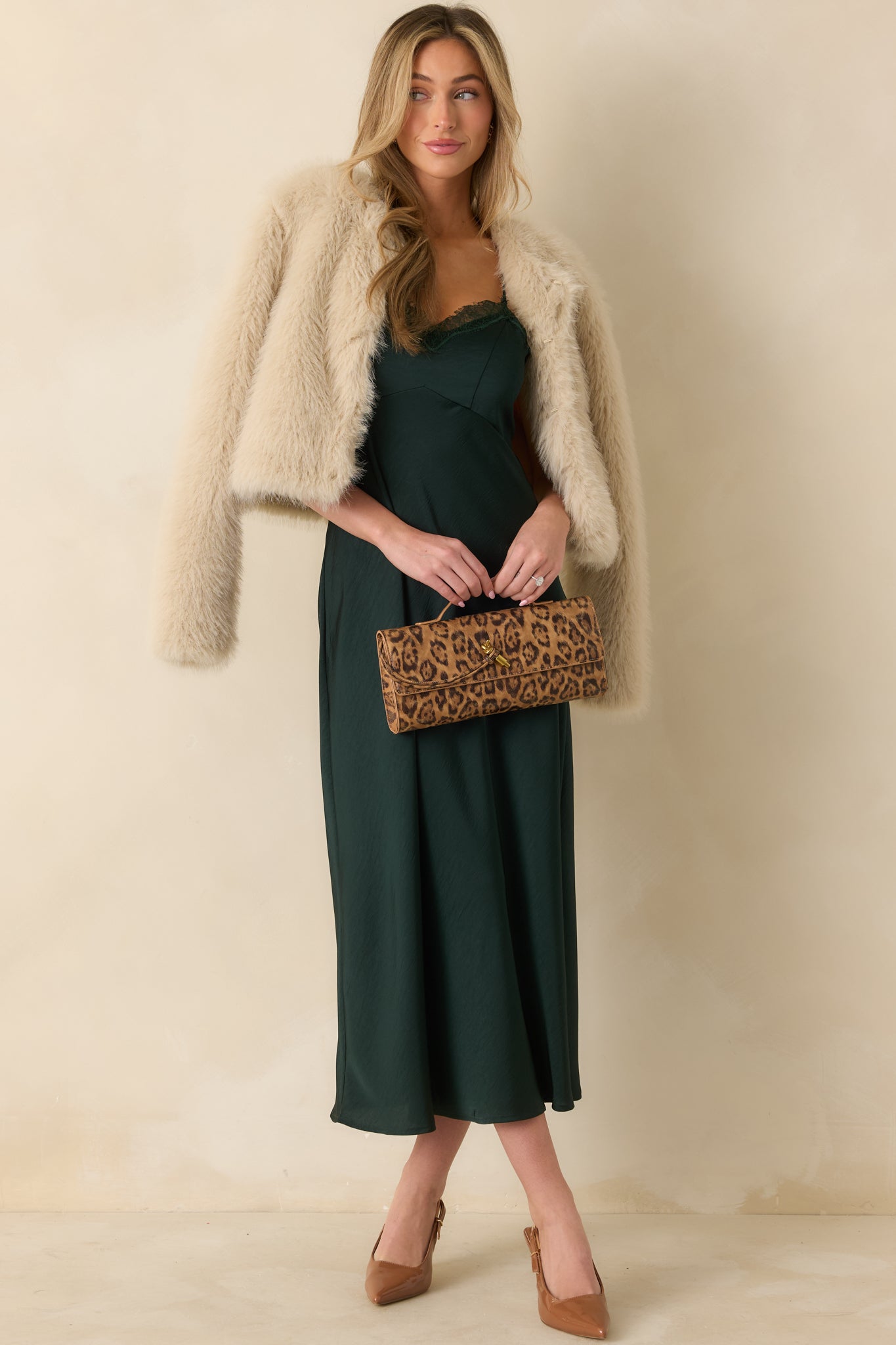 Front-facing image emphasizing tie-back detail and adjustable straps creating a customizable fit.