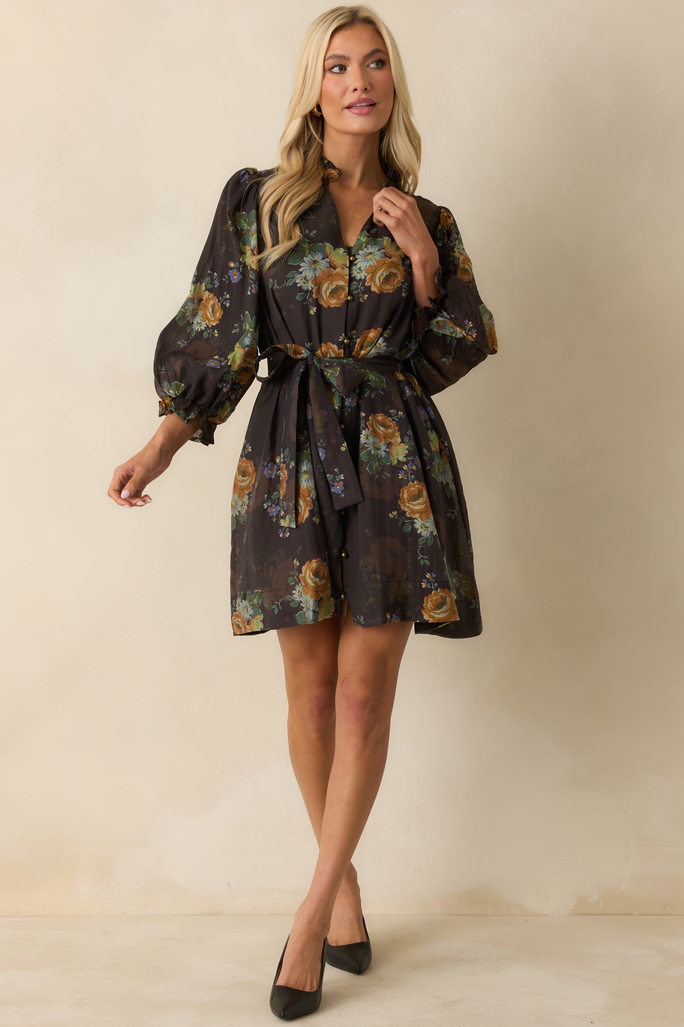 Front view of brown floral mini dress highlighting the self-tie waist belt and side pockets.