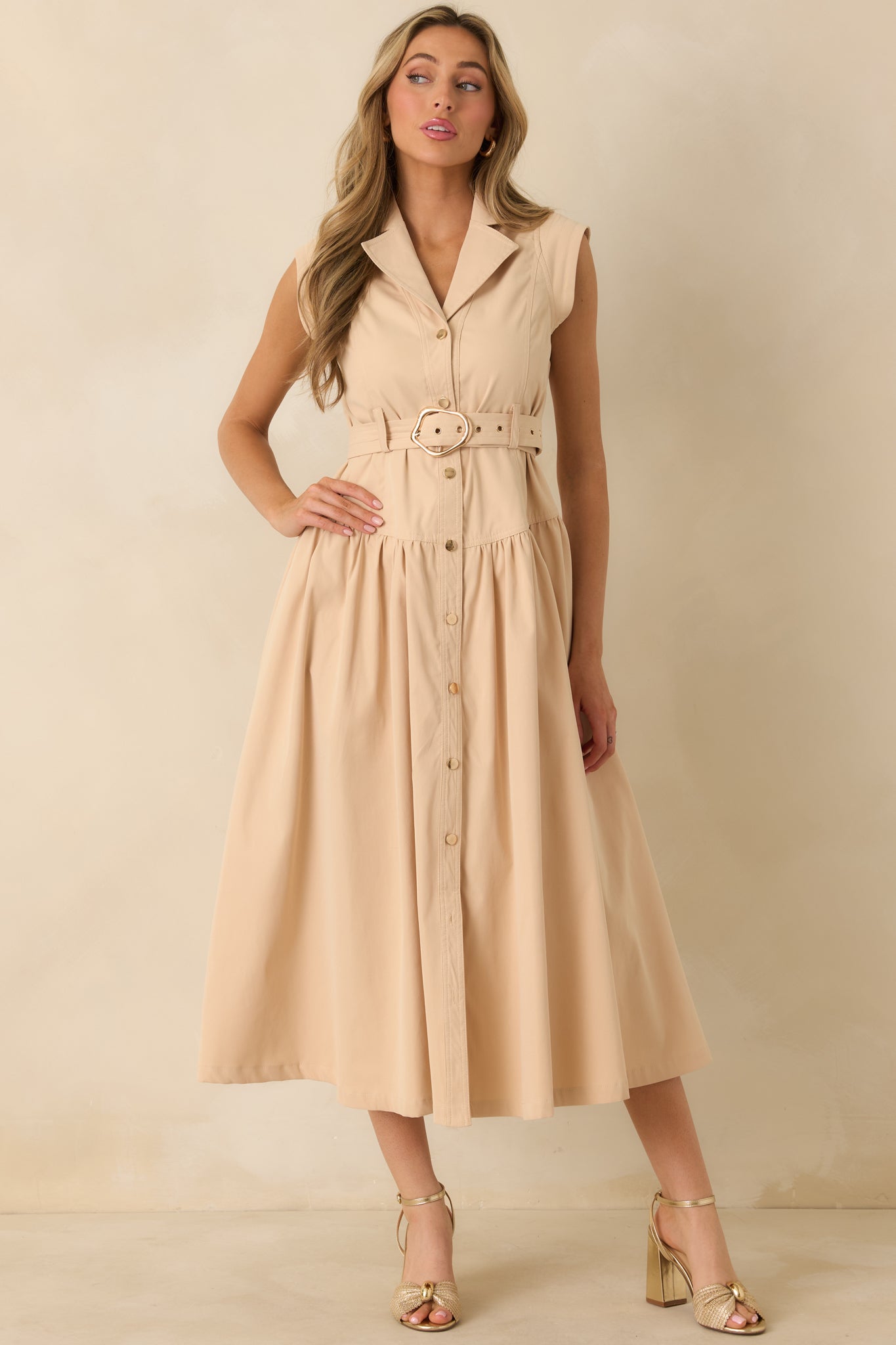 Front view showcasing the clean button-down front and softly voluminous skirt silhouette.