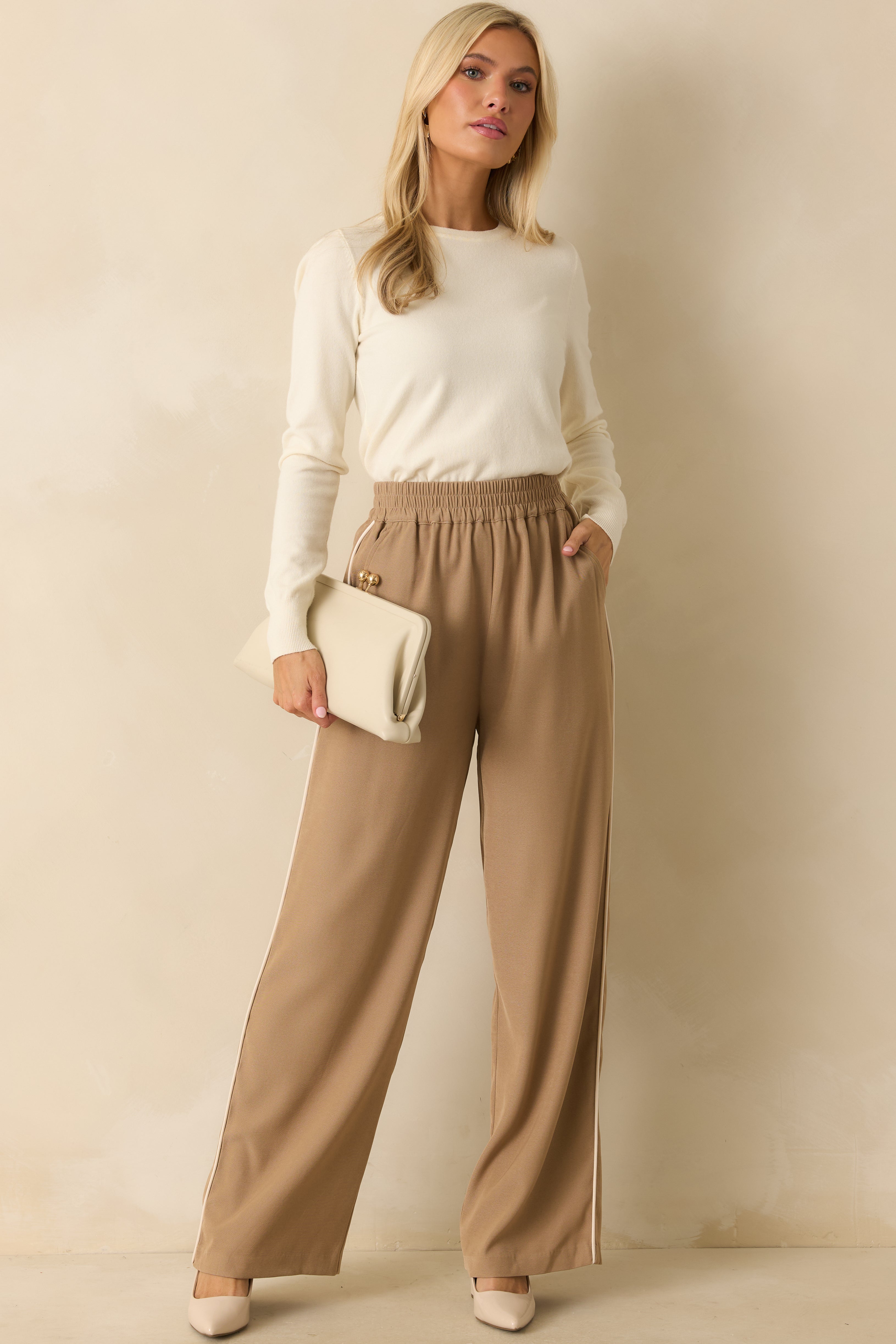 Front view of camel brown wide leg pants showing the elastic high-rise waistband and relaxed drape.