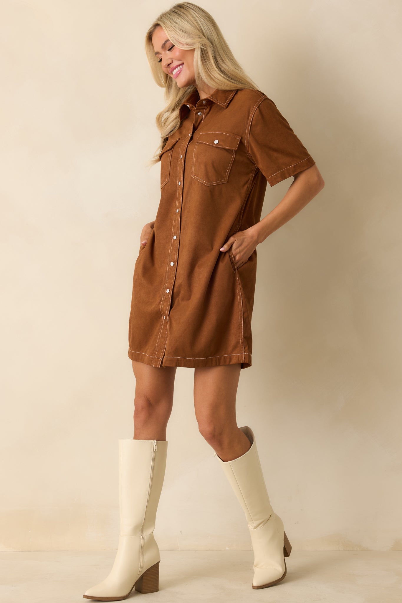 Front view of cinnamon faux suede dress showing full snap-button closure and straight hemline.