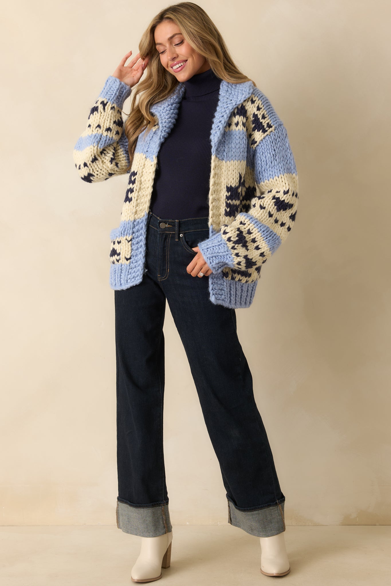 Front view of colorblock cardigan highlighting front patch pockets, thick ribbed trim, and relaxed fit.