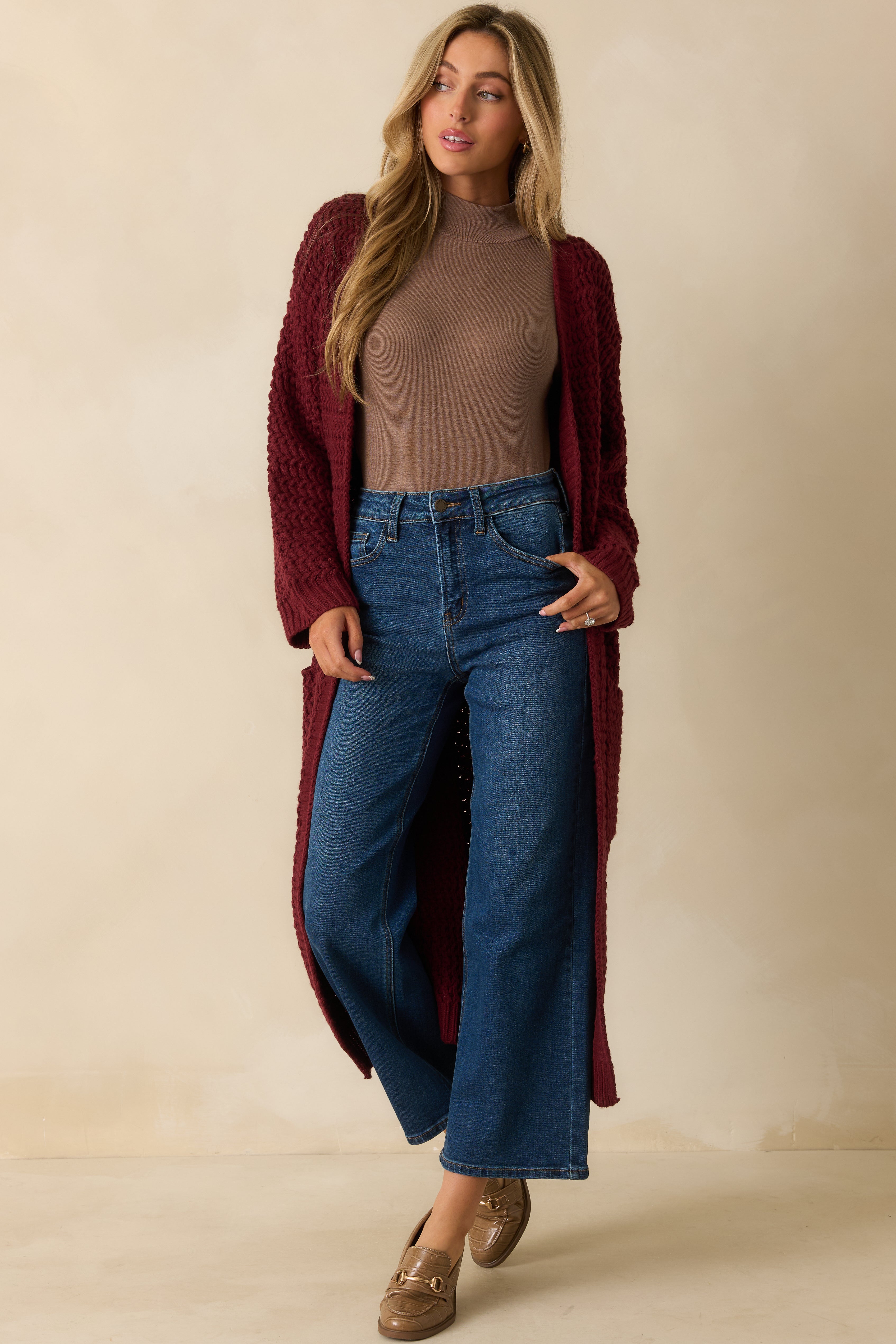 Front view emphasizing the drape and longline length of the open-front cardigan.