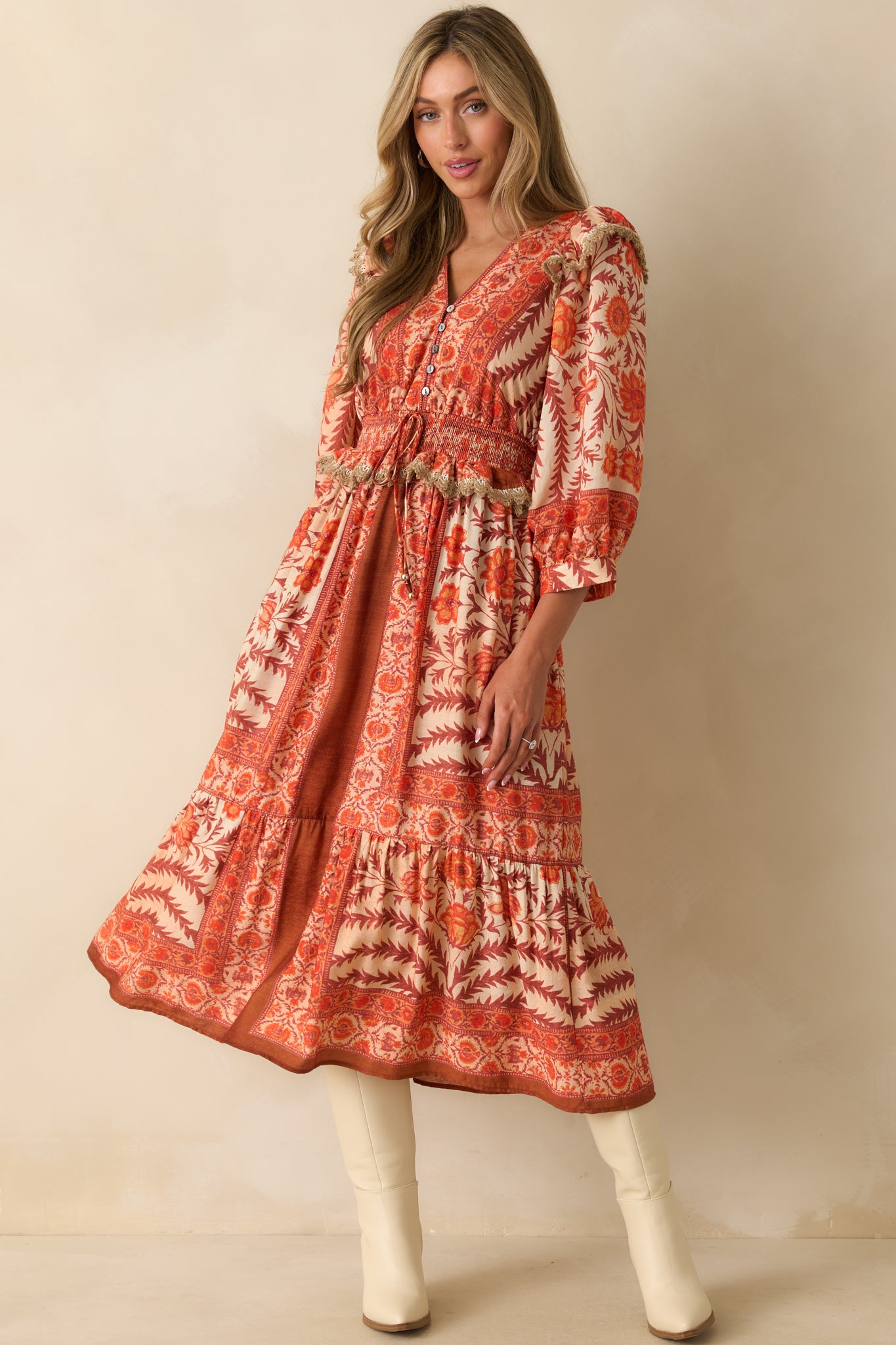 Full body front view highlighting the button-front bodice and smocked peplum-style waist with drawstring self-tie.